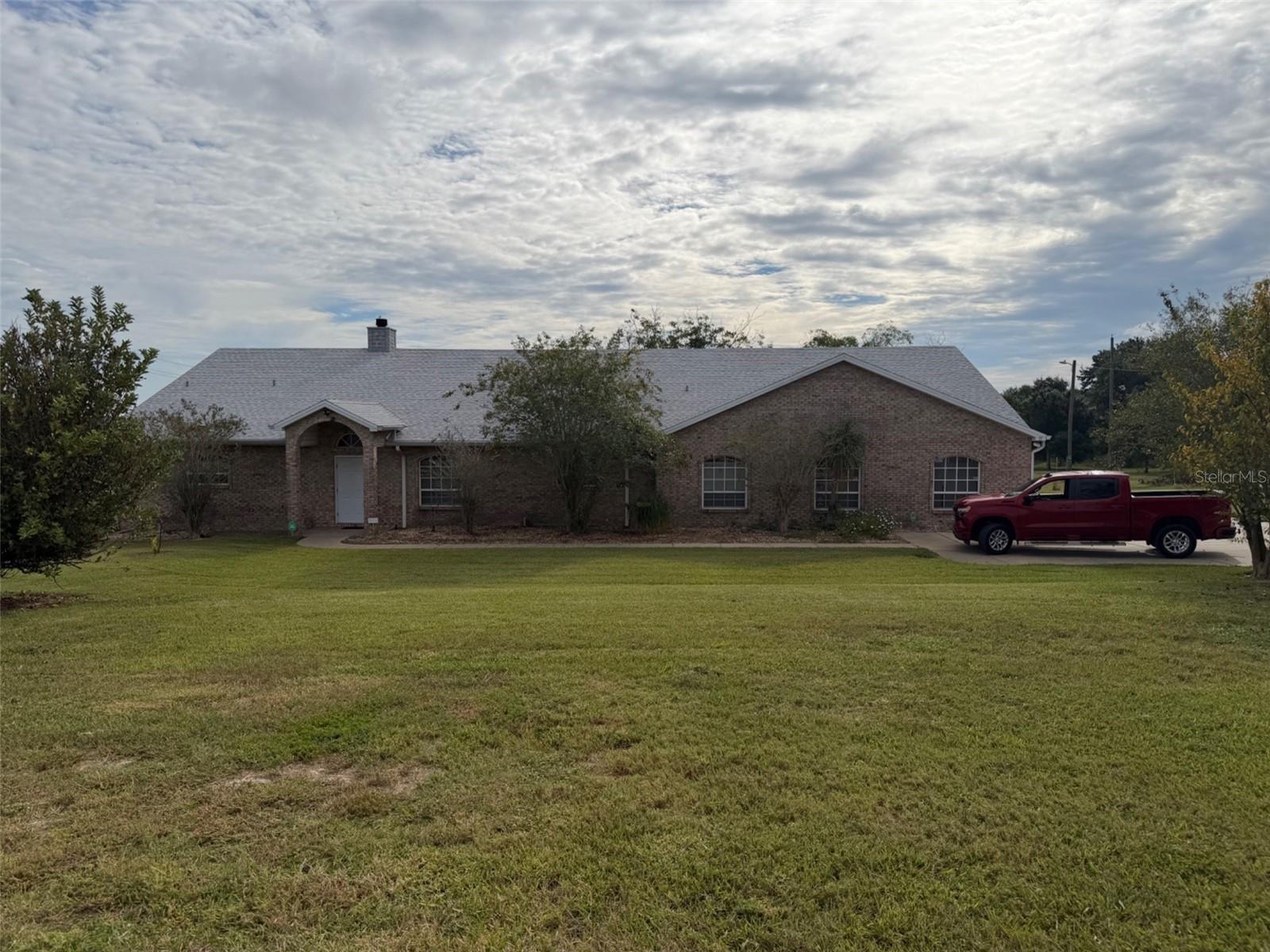 3 bedroom 3.5 bath real brick home on 4.67 acres! Zoned rural ag. Can be a family compound with up to two more homes can be built if it’s family. L shaped kitchen with eat in booth with granite counter tops! All rooms are oversized! All bedrooms have there own walk in closet and bathroom ! Master bedroom is an incredible 30 by 25 ! Property has two wells, one 4 inch with 5 HP motor which feeds the house and home irrigation system and one 8 inch well for the irrigation for crops with a diesel engine. One of the last properties in this area with this much land. Access to I 4 only 4 miles away! Property can be farmed or an equestrian home! Horses allowed.