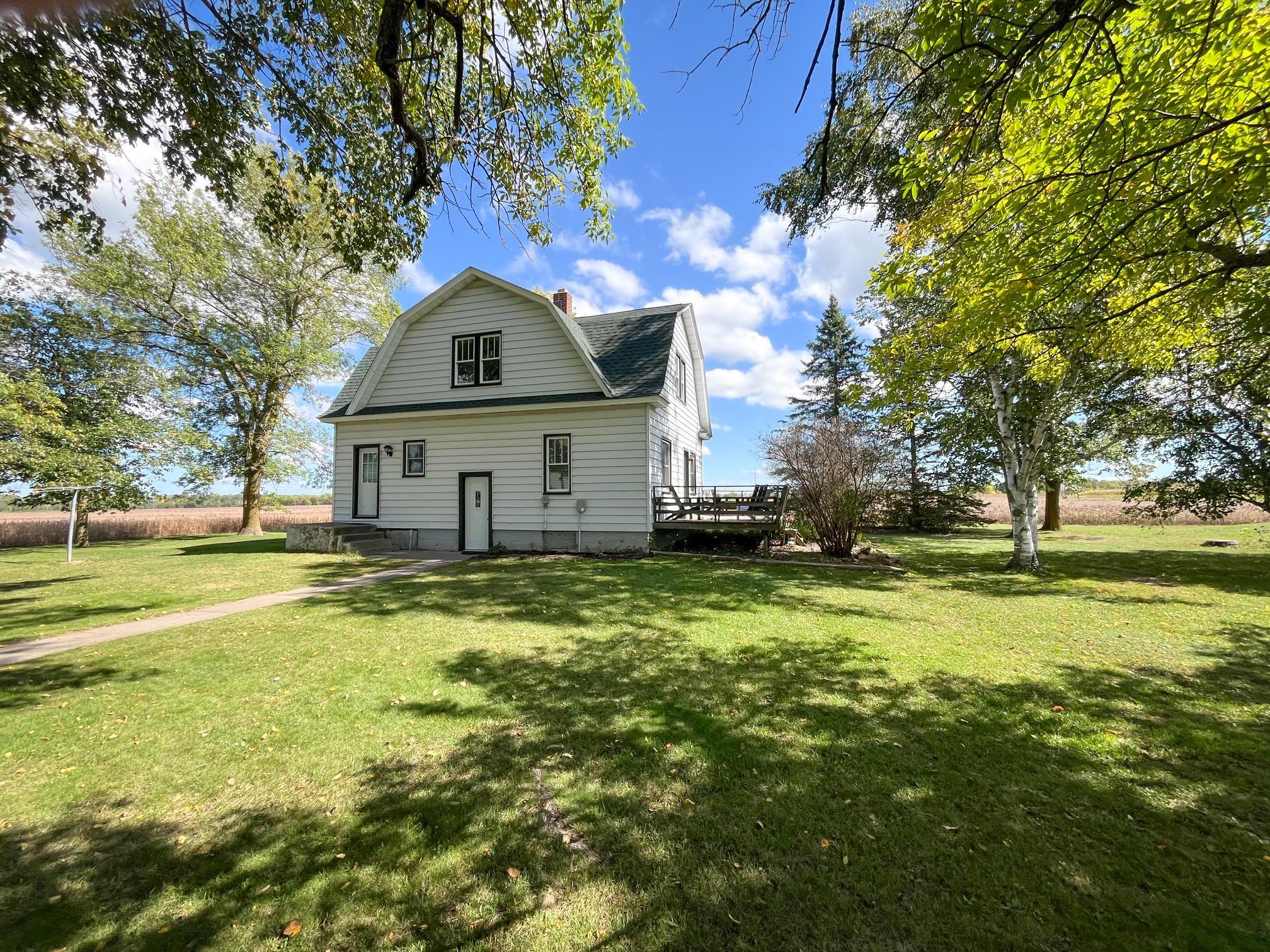 Country living, room to roam and recreation right out your door! Set on 2 acres and neighboring more than 700 acres of public hunting land, this charming 3-bedroom home offers a peaceful setting along with extensive updates throughout. Beautifully refurbished hardwood floors add warmth and character, while major improvements include a new roof and septic system in 2022, all-new electrical in both the home and garage, and new windows and doors! The kitchen features a new range and dishwasher, and central air and fiber-optic internet add comfort and convenience. Outside, you'll find a spacious three-stall garage with 220V power-ideal for high-powered tools, equipment or EV charging-plus a little chicken coop and plenty of space to enjoy the outdoors. A hard-to-find combination of acreage, recreation, character and important updates, all in a peaceful country setting just minutes from town!