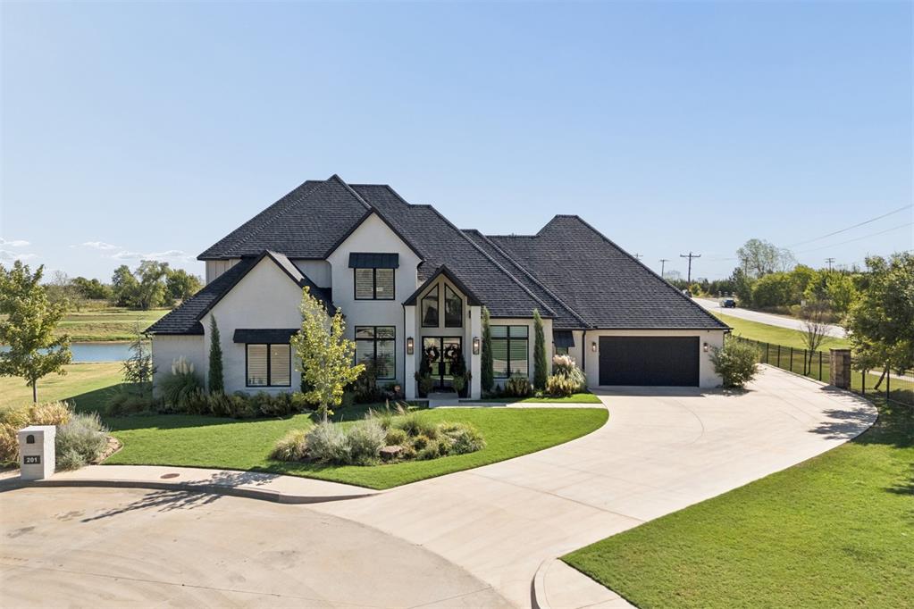 Experience refined luxury and exceptional livability in this stunning custom home overlooking the 5th tee box on the Eastside of Oak Tree Golf and Country Club. Tucked away on a private cul-de-sac lot, this beautifully designed residence offers peaceful golf course views, abundant natural light, and exceptional privacy.The true mother-in-law floor plan offers incredible versatility with 5 bedrooms, 4.5 baths, 2 living areas, and a dedicated workout room. Designer finishes, sophisticated lighting, and custom details create an elegant yet inviting atmosphere throughout.At the heart of the home is a culinary-inspired kitchen with a custom designed vent hood, generous workspace, and seamless flow to the main living areas. A stylish wet bar makes entertaining effortless, while expansive windows fill the home with natural light and showcase the beautiful views.Two spacious living areas provide room to gather, relax, and entertain, while the thoughtful floor plan offers privacy for family and guests. The 4-car garage provides ample parking and storage.From the peaceful golf course setting and private cul-de-sac location to the exceptional craftsmanship and designer touches, this home offers a rare combination of luxury, functionality, privacy, and breathtaking views in one of Oak Tree's most desirable settings. A truly special home designed for elevated everyday living and effortless entertaining.