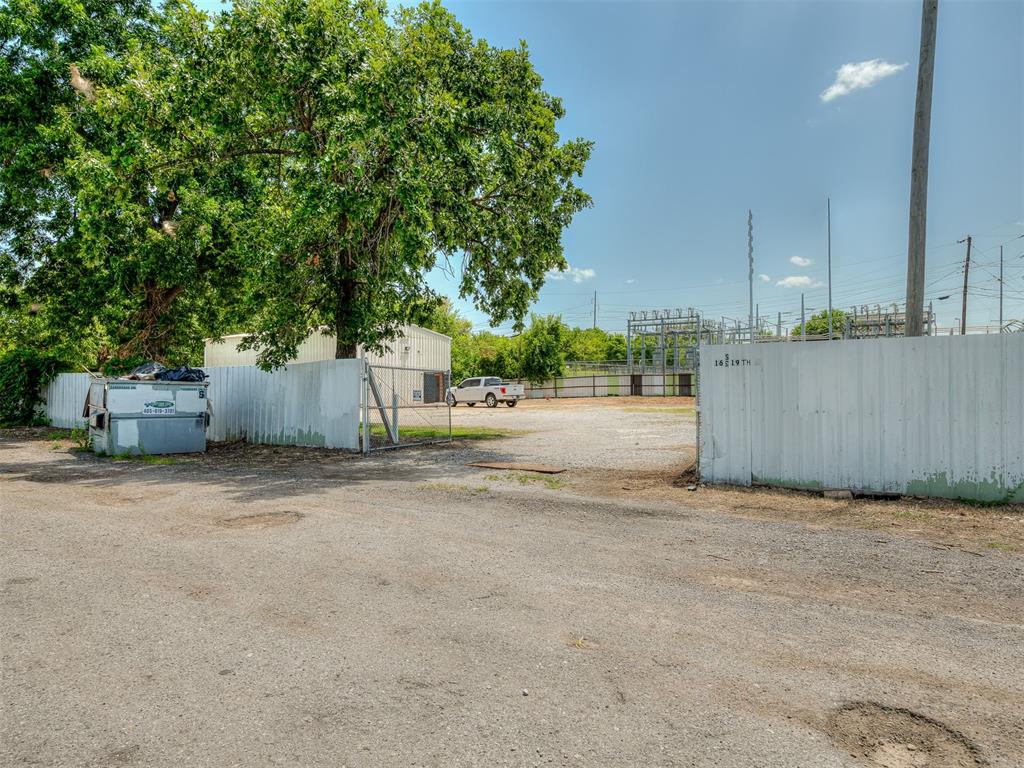 Commercial building for lease at 12 SE 19th St., Oklahoma City, OK. This 2,000sq. ft. shop sits on approximately 2.5 acres and features a fully privacy-fenced yard, offering secure outdoor storage and workspace just minutes from downtown Oklahoma City. Lease rate is $2,500 per month with a $2,000 security deposit. Property features include 3-phase electrical service, all-new LED lighting, an overhead crane, Commercial compressor,  a 16-foot sliding shop door, a full bathroom with shower, a small office with a window A/C unit, and five storage buildings. This versatile property offers excellent flexibility for a variety of commercial or industrial operations requiring both shop space and a secure yard. Tenant to verify permitted use with the City of Oklahoma City. Lease terms and availability are subject to owner approval. This property is ideal for a plumbing, electrical, construction, trucking, welding, or other trade-related business needing secure yard space and a functional shop