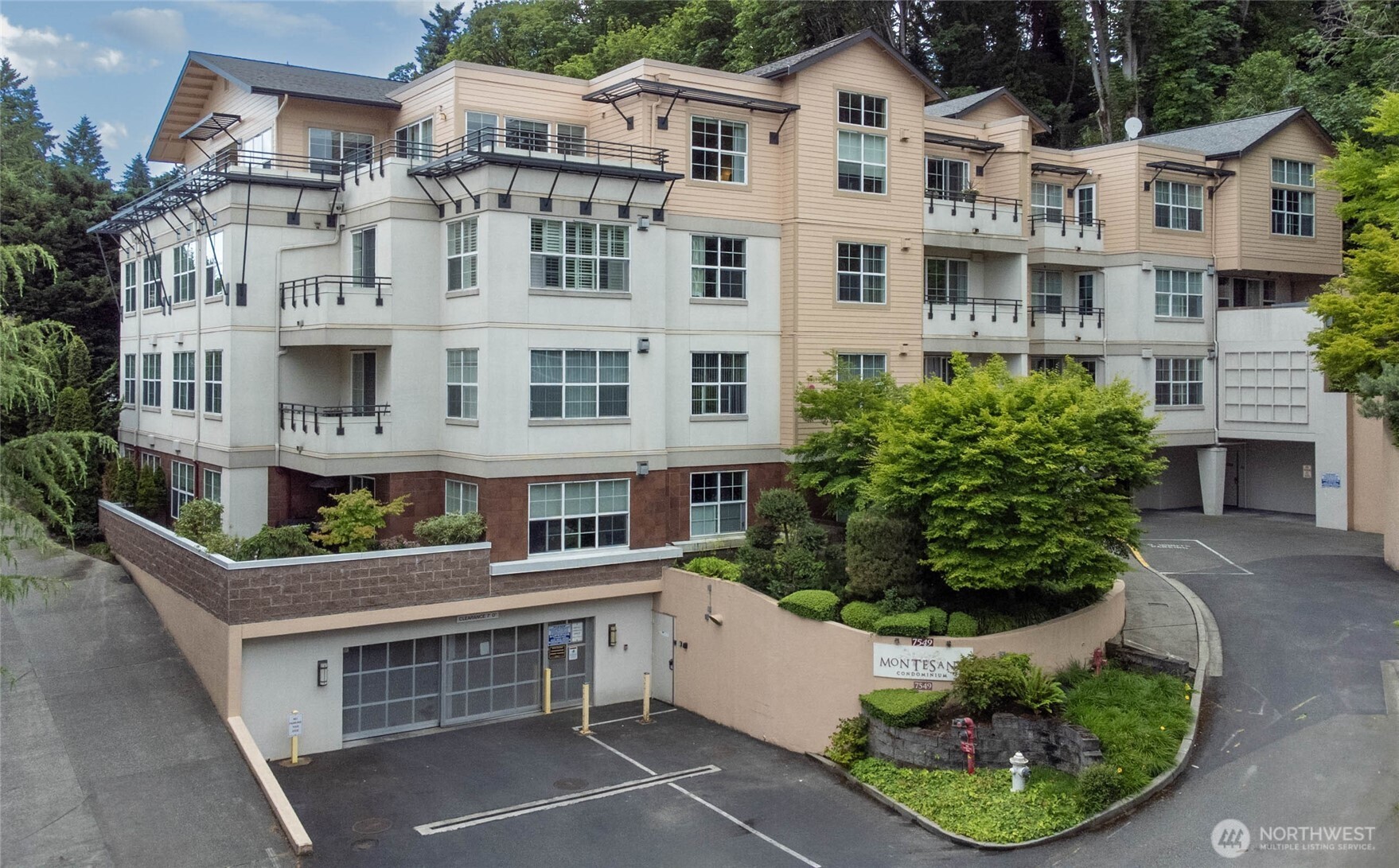 Welcome home to stylish living in the heart of d/t Mercer Island’s desirable Montesano community! This spacious 2-level end unit lives like a single-family home with a private patio, partial views of d/t Bellevue, lake, mtns, in-unit laundry, tons of storage, and secured garage parking for 2, optional for EV . Enjoy an open-concept layout with a cozy fireplace and updated kitchen featuring quartz counters and stainless-steel appliances. New floor and fresh paint in the living area. Newer heat pump was installed in 2023. The large primary suite offers a 12+ foot ceiling, custom-built closets, full bath, and soaking tub. Both bedrooms have full bath. No neighbors above or below. Walk to shops, parks, trails, and transit, with easy access I-90