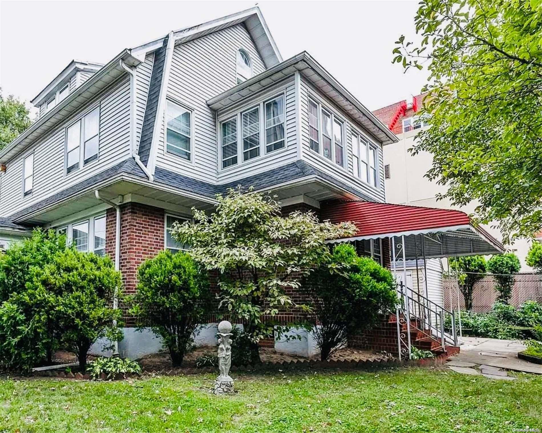 Spotless and Spacious Center-Hall Colonial on Oversized Corner Lot!  This beautifully maintained home features an inviting entrance foyer and a HUGE, elegant living room with a fireplace for entertaining. The spacious formal dining room flows into an eat-in kitchen. Additional highlights on the first floor include an enclosed porch for year-round relaxation. A staircase leads to the second floor, where you'll find two generously sized bedrooms, a full bathroom, and a large primary suite with its own en-suite bath. The second bedroom has a spacious sunroom. The third floor offers two more bedrooms, a full hall bath, and extra storage. Enjoy hardwood floors throughout, plus a finished basement with a recreation room, laundry/utility area, office space, abundant storage, and a cedar closet. The expansive, fenced-in yard features lovely gardens, while the detached 2-car garage and long private driveway offer plenty of parking. With ample space for home offices, this property is ideal for those working from home. Conveniently located near transportation, restaurants, shopping, parks, and more, this home is the perfect blend of charm and modern convenience. Don't miss out on making it yours!