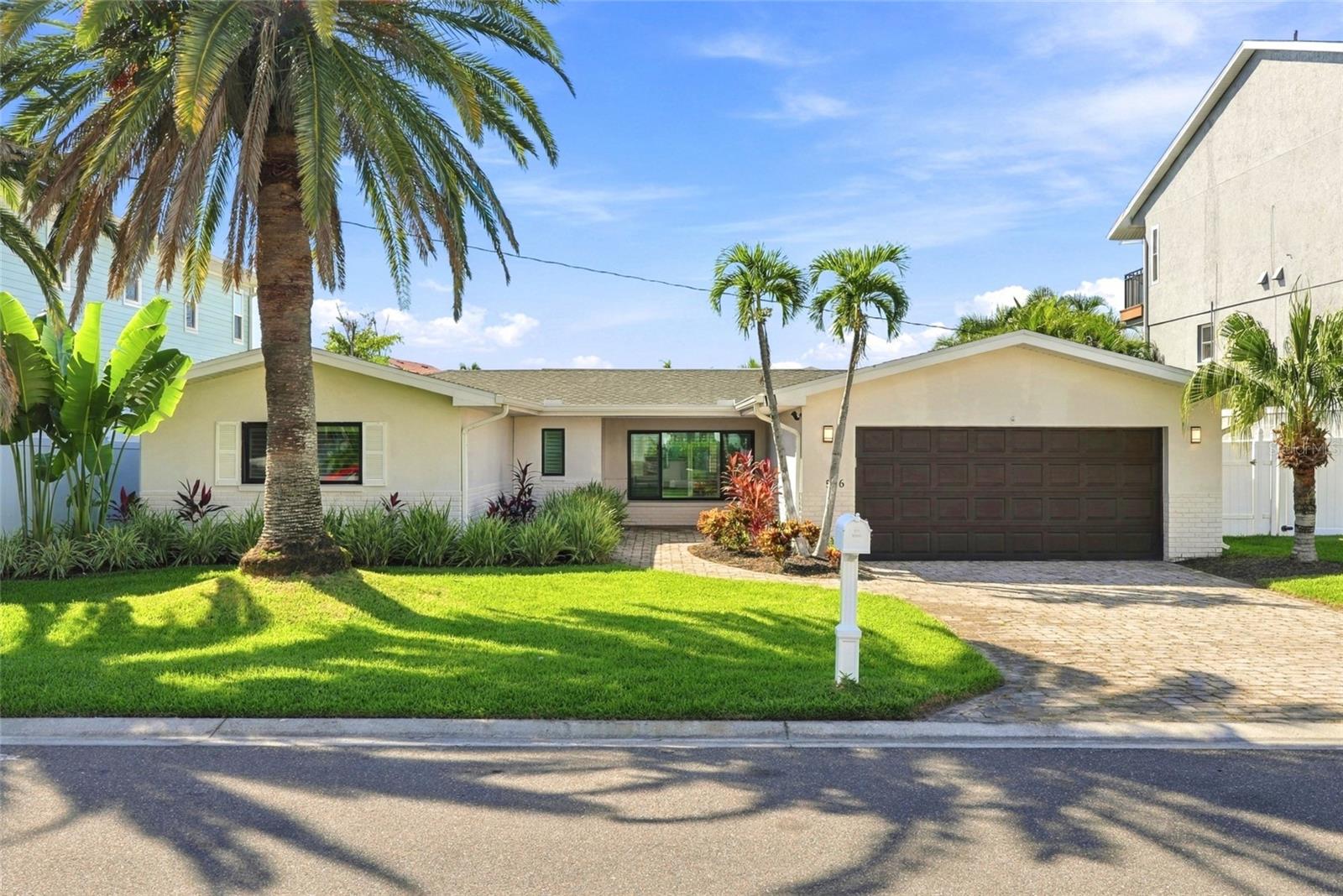 Welcome to waterfront living at its finest in Crystal Island, one of Madeira Beach's highly sought-after waterfront neighborhoods! This beautiful coastal home offers 3 bedrooms, 3.5 bathrooms, 2,020 square feet of living space, and a spacious 2-car garage.Situated along a peaceful, no-wake canal, this property offers calm, protected waters ideal for docking your boat, launching jet skis, and enjoying easy access to the water.Step outside to your own private backyard oasis, featuring a newer heated pool (2023), outdoor kitchen, and 13,000-pound boat lift. The perfect setup for entertaining, relaxing, and enjoying waterfront living year-round!Inside, you?ll find all brand-new appliances and several updated major systems, including a 2025 AC system, 2024 water heater, and 2017 seawall. The roof was installed in 2015 and has been recently inspected, with no leaks or issues reported. A fully operational irrigation system keeps the tropical landscaping looking its best.Located in the desirable Crystal Island community, this home combines the charm of a peaceful waterfront neighborhood with the convenience of being close to Madeira Beach's beautiful beaches, boating, dining, and entertainment.With its waterfront amenities, thoughtful updates, and prime location, this home is ready for you to enjoy the coastal lifestyle you've been dreaming of.