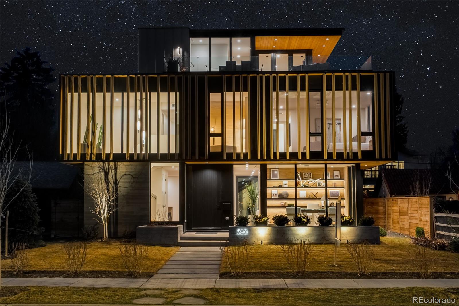 Built by Caliber, 580 South Franklin’s status as the 2024 Home & Garden Colorado Designer Showhouse is apparent in every elegant detail. This architectural masterpiece sits on one of Washington Park’s most coveted streets, offering panoramic park and mountain views. Like a work of art, the exterior of the home draws the attention of passersby with its contemporary wood accents and expansive glass panels. This motif continues inward to a sophisticated interior brimming with luxurious, yet understated finishes. A main-floor office showcases executive-level design with outdoor connectivity and underlit shelving. An entertainer’s layout follows with an open-concept living, dining and kitchen area; the latter of which shines with a caterer’s pantry, waterfall island and high-end appliances. Elegance abounds in a primary suite characterized by a private sitting area, fireplace, remarkable walk-in closet and a designer en-suite reminiscent of five-star resorts. The third floor boasts an indoor/outdoor entertaining space with fire pit and breathtaking views, plus an additional bedroom and bath. The expansive basement offers a family room, workout space and sauna. With a Lutron Radio Ra3 lighting system, elevator, and a wine closet, this home is the epitome of sophisticated living.