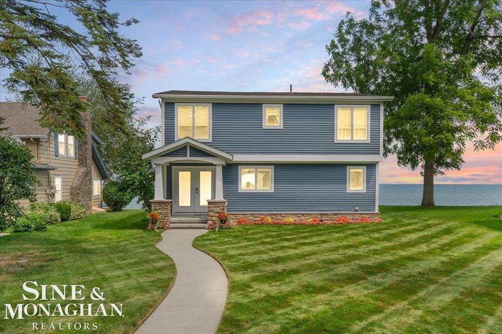 Experience lakeside living at its finest in this gorgeous lakefront home on Lake Huron. Completely updated in 2009 with new electrical, plumbing, siding, and windows, plus a new furnace and A/C in 2019. This 4-bedroom, 2-bath home offers incredible views from every room and a stunning stamped concrete patio perfect for entertaining. The updated kitchen and bathrooms blend modern comfort with timeless charm. Enjoy your private seawall and walk to town for dining and shopping. A detached 2-car garage adds convenience to this exceptional property. Breathtaking views, modern updates, and prime location make this a true Lake Huron gem