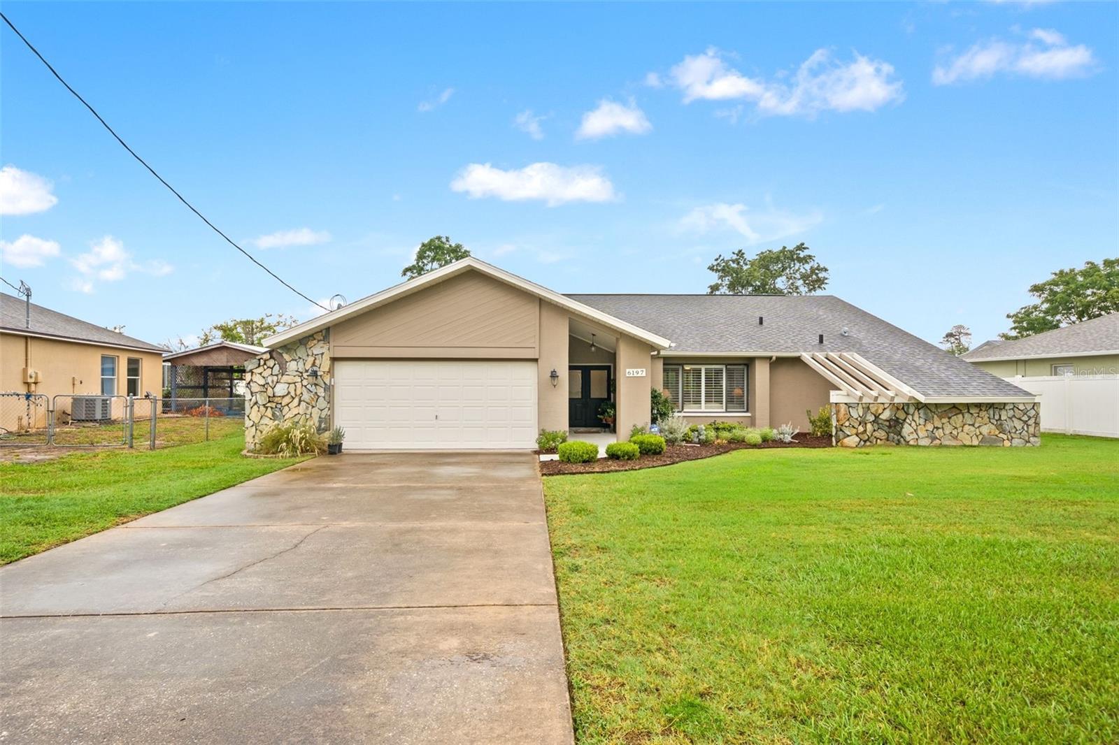 Curb appeal and exceptional craftsmanship welcome you to this impeccably maintained, completely updated, ARTISTIC CUSTOM POOL HOME--original owner! This stunning 3-bedroom residence offers the space, storage, and thoughtful upgrades today's buyers desire. Enter through the beautifully tiled double-door entry into a light-filled living room and family room combination featuring gorgeous LVP flooring throughout, plantation shutters, custom doors, and attention to detail at every turn.  Three TV's included.The warm and inviting family room is the perfect gathering space with a gas fireplace, open concept design, and direct access to the pool and lanai. The beautifully appointed kitchen features rich white wood cabinets, concrete countertops, a wood-topped center island, new appliances, and a new low-profile microwave, along with abundant cabinet and counter space for effortless entertaining.The spacious bedrooms provide comfort and privacy for family and guests. The guest bathroom includes a convenient tub/shower combination. The primary suite offers a custom closet and updated bath with tiled shower and double vanity.Outdoor living shines with a designer-lit pool, inviting lanai, and electric fireplace--creating the perfect Florida retreat. Fresh exterior paint in 2024 enhances the home's curb appeal. Additional features include a NEW water softener, central vacuum system, irrigation system, security system, ceiling fans throughout, and an oversized garage offering plenty of space for vehicles, storage, and more.  Location, location, location! Conveniently located near shopping, restaurants, hospitals, schools, parks, and golf courses, this home offers everyday convenience in a prime setting. Enjoy the natural beauty of the Weeki Wachee River with endless opportunities for paddleboarding, boating, and fishing. Take in stunning sunsets at Pine Island Beach Park, a perfect nearby escape for relaxation and coastal enjoyment. With easy access to the Suncoast Parkway, Tampa International Airport and all that the Tampa Bay area has to offer are within effortless reach.  This exceptional home blends elegance, comfort, and functionality with the quality and care of a true original-owner property.  CALL TODAY
