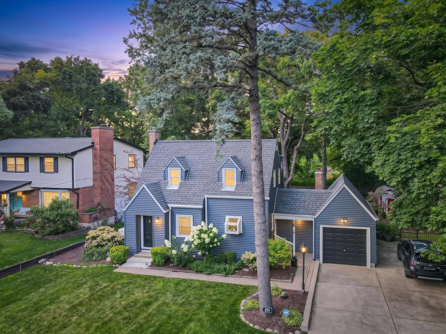 Adorable Cape Cod offering all the charm of yesteryear with the modern updates today's buyers love! The beautifully redesigned kitchen features quartz countertops, newer shaker-style cabinetry with exceptional storage, a farmhouse sink, stylish fixtures, an instant hot water tap, and a charming garden window. Built-in cabinetry throughout the home adds both functionality and timeless character.    The spacious country kitchen overlooks the living room, which could also serve as a formal dining room. French doors open to a cozy family room featuring a wood-burning stove, creating the perfect gathering space.    Large picture windows in the family room, kitchen, and office provide panoramic views of the picturesque, fenced backyard. The private office offers its own entrance and pocket doors, making it ideal for working from home or meeting clients.    Both bathrooms have been tastefully updated, and beautiful hardwood floors run throughout the home. The basement provides ample space for storage and recreation and includes updated drain tile for added peace of mind.    Newer windows, appliances, and mechanical systems reflect the exceptional care and maintenance this home has received over the years.    An additional lot offers outstanding potential for future expansion or the opportunity to subdivide and build. Surrounded by towering mature trees, the backyard has a peaceful, park-like setting. Best of all, the home is located just down the street from beautiful Lord's Park, where you can enjoy walking trails, gardens, and year-round recreation.