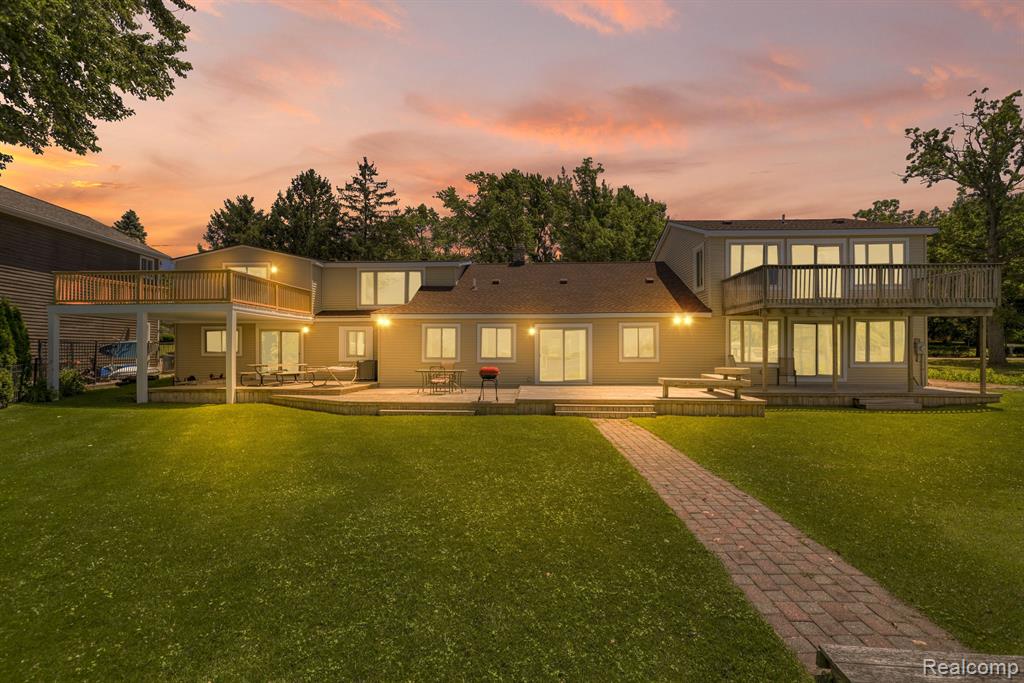 Embrace lakeside living on Lake Chemung. Nestled on a tranquil lot, this  4 bedroom, 3.5 bathroom home offers unparalleled views and direct access to the sparkling waters. Step inside to discover a bright and airy living space, featuring expansive windows that frame breathtaking lake vistas. The open-concept design With a Natural Stone fireplace updated kitchen with stainless steel appliances. The master suite beckons with its panoramic lake views is 2 stories and has over 1200 square ft, with master bath and jacuzzi tub,  and ample closet space. Two additional bedrooms provide flexibility for guests or a home office, each offering comfort and privacy. Heated Outside, your private oasis awaits. Enjoy leisurely mornings on the sun-drenched deck, sip coffee as you watch the sunrise over the water, or gather with loved ones for sunset barbecues on the patio. The spacious yard gently slopes down to your own private dock, inviting you to indulge in boating, fishing, and water sports right from your doorstep. Conveniently located near local amenities and within a desirable school district, this home offers the perfect blend of tranquility and accessibility. Whether you're seeking a weekend getaway or year-round lakeside living, 1794 Hughes Rd presents a rare opportunity to own a slice of paradise on Lake Chemung. Key Features: 4 bedrooms, 3.5 bathrooms,  Updated kitchen with stainless steel appliances, Expansive living area with panoramic lake views, Master suite with ensuite bathroom/ tankless water heater and lake vistas, Private deck and patio overlooking the lake, 2 garage attached heated garage with epoxy floors. Private dock for boating and water sports!Don't miss your chance to experience the beauty of lakefront living at 1794 Hughes Rd. Schedule your showing today and envision the endless possibilities of life on Lake Chemung.