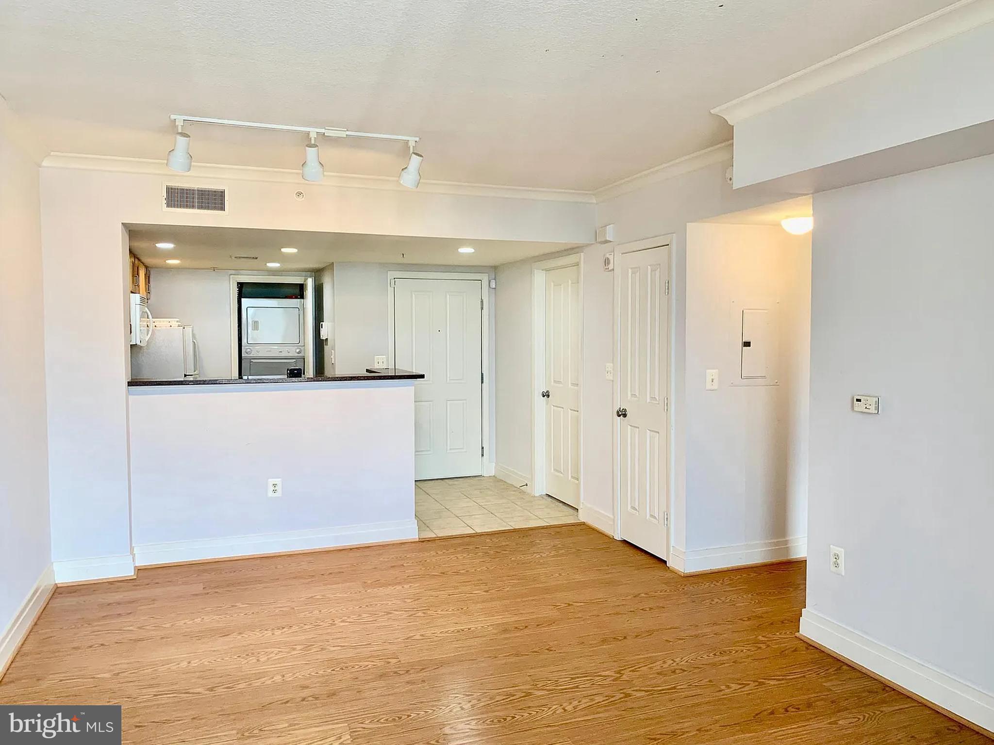 Beautiful 19th-floor one-bedroom, one-bath residence available for rent in the sought-after 414 Water Street condominium in downtown Baltimore. This well-maintained unit offers approximately 630 square feet of comfortable, thoughtfully designed living space with an open living and dining area that flows to a private balcony with impressive city views. Large sliding glass balcony doors bring in abundant natural light, creating a bright and inviting atmosphere. The kitchen features ample cabinetry and modern appliances, while the unit also includes a full-size in-unit washer and dryer for everyday convenience. The spacious bedroom offers two closets, providing excellent storage rarely found in similar downtown units.Residents enjoy full-service building amenities including 24-hour concierge, secure entry, fitness center, outdoor pool, business center, party room, and garage parking. Gas, water, and sewer are included per building provisions. Ideally located just moments from the Inner Harbor, Harbor East, Federal Hill, restaurants, entertainment, and major commuter routes, this residence offers a perfect blend of comfort, convenience, and upscale city living—ideal for professionals seeking a low-maintenance lifestyle in the heart of Baltimore.