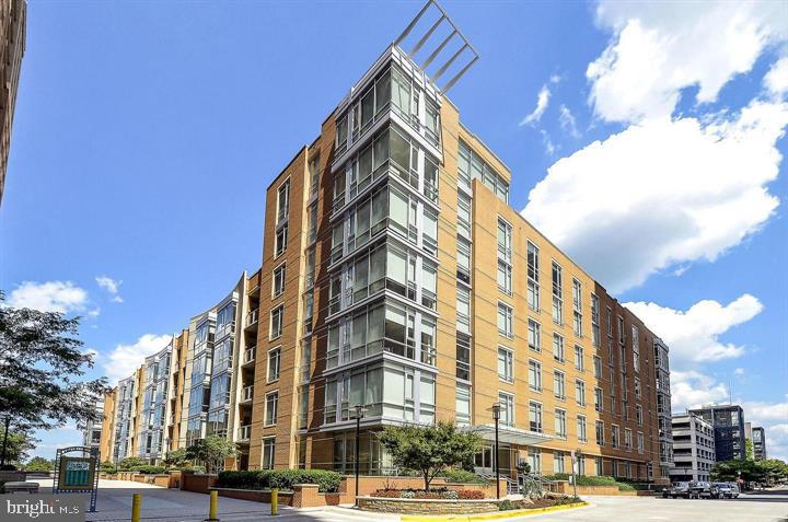 Rare penthouse-level residence at Midtown North in the heart of Reston Town Center. This 2-bedroom, 2-bath home spans 1,374 square feet in an intimate, separate building of just 8 units — only 2 per floor — and is served by a private elevator that opens directly into the residence — true penthouse living.Soaring 11-foot ceilings and floor-to-ceiling windows fill the open living space with natural light, while the top-floor position offers unobstructed views. The layout flows seamlessly from living to dining to kitchen, ideal for everyday living and entertaining alike.Move-in ready with major systems already updated: HVAC system fully replaced (2019), all kitchen appliances and washer/dryer replaced (2019), and a new hot water heater (2026) — meaning no near-term big-ticket replacements for the next owner. Additional updates include freshly painted througout and primary owners suite carpetAdditional highlights include two deeded garage parking spaces and a private storage unit, a combination rarely available together in this community. Residents enjoy Midtown North's full amenity package: 24-hour concierge, fitness center, resident lounge, and rooftop sundeck.Steps from Reston Town Center's restaurants, shops, movie theater, and weekly farmers market, with easy access to the Wiehle-Reston East Metro station and the Dulles Toll Road. A rare opportunity to own one of the building's most distinctive residences.