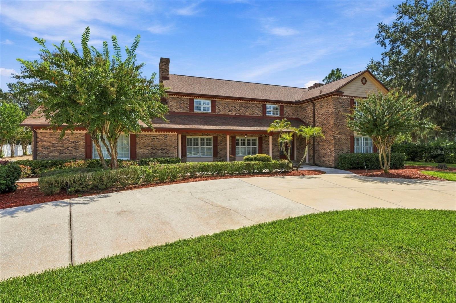 Welcome to Hickory Creek, Brandon’s premier horse-friendly community renowned for its tree-lined streets and custom estates. Nestled on over 1.6 private ACRES, this timeless traditional beauty boasts 4,454 square feet of comfortably designed space for modern living, offering an unparalleled blend of elegance, functionality, and room to grow. The Main Floor: Designed for functional living features formal living and dining rooms, a cozy family room with a fireplace, a dedicated MEDIA/BONUS ROOM, and an additional flexible bonus room with cabinets and closet storage. The heart of the home is the recently updated central kitchen, complete with custom cabinetry, solid surface counters, stainless steel appliances, and a built-in dinette. A flexible DEN/OFFICE (easily a 6th bedroom) sits up front and is adjacent to a full bath, while an oversized laundry room with additional hook-ups for more washer & dryers if needed, and a dedicated hobby/pantry/storage room at the back of the home providing ultimate convenience. The Upper Level: Ascend the elegant staircase to find 5 spacious bedrooms and 3 full baths. Nice finishes flow throughout the home, including WOOD and tile flooring (carpet found only in the primary closet), plantation shutters, DOUBLE PANE WINDOWS, barn doors, and two FIREPLACES. The Outdoor Oasis & Guest Apartment: Step outside to an enormous, SOLAR-HEATED POOL surrounded by expansive decking and a relaxing gazebo—perfect for entertaining. The true crown jewel of the backyard in this estate is the 36x48 multi-purpose, air-conditioned 5-STALL BARN. Offering approximately 1,728 sq. ft. of concrete-floor space with its own kitchen, the possibilities are endless. Plus, a private 528 sq. ft. upstairs guest apartment (or home office, hobby room, etc) that features a full bath, bedroom, and living room. Several large sheds (12x30 and 12x24) next to the barn are also perfect for storage, workshop, or hobbies. Additional exterior features include a large circle driveway, a vegetable garden area, and irrigation well.  Great location in South Brandon that is just minutes to shops, restaurants, terrific schools, and major roads. Opportunities of this scale and caliber are incredibly rare. Schedule your private showing today!