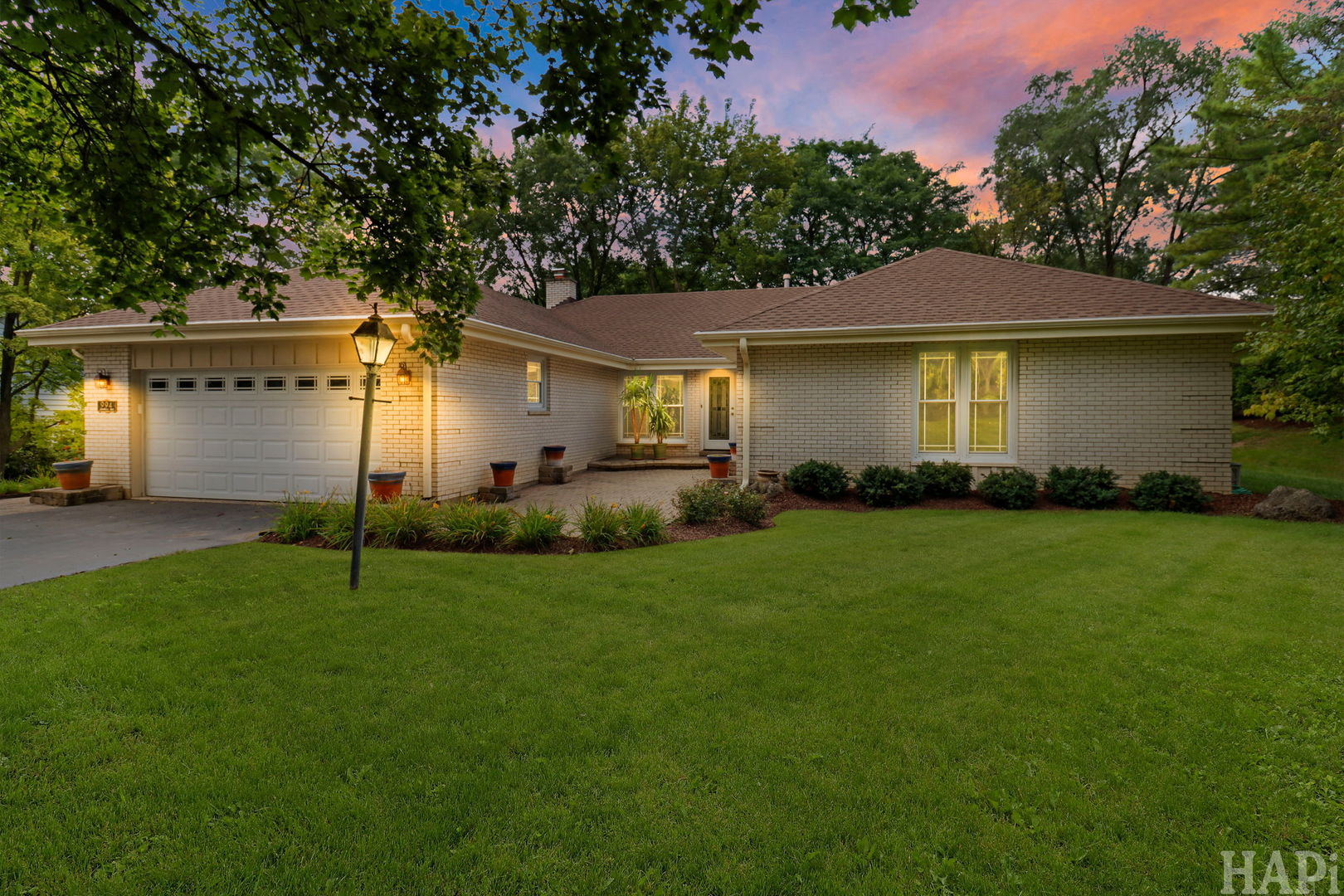 Welcome to this beautifully maintained one-story home featuring 4 spacious bedrooms, 3 full bathrooms, a fully finished basement, and an oversized attached 2.5-car garage. As you enter, you're greeted by beautiful marble flooring in the family room, highlighted by a charming wood-burning fireplace. The nicely sized kitchen offers stainless steel appliances, beautiful granite countertops  and a comfortable eat-in area. The living and dining room combination features beautiful hardwood floors and provides access to the private backyard. All four generously sized bedrooms are conveniently located on the main level and feature hardwood flooring, along with two full bathrooms. The fully finished basement  offers an abundance of additional living and entertaining space, complete with a center bar area-perfect for family gatherings and entertaining. This level also includes a third full bathroom, laundry room, and a separate mechanical room. A large, bright crawl space provides excellent additional storage. The home is equipped with three separate sump pumps, including one in the crawl space. Numerous improvements have been completed throughout the years, including roof, fascia, soffits & gutters (2022); HVAC (2018), regularly serviced; Bosch dishwasher (2021); crawl space liner, French drain & sump pump (2014); attic insulation (2015); Johnson water softener (2014); GE microwave (2024); basement storm door & reinforced doors at the side basement entrance (2022); security film on glass doors, windows & skylights (2019); kitchen sink/disposal replacement (2023); and driveway asphalt/blacktop (2026). Ideally located near shopping, dining, entertainment, the train, and within walking distance to the Village. Nothing to do but move in and enjoy!