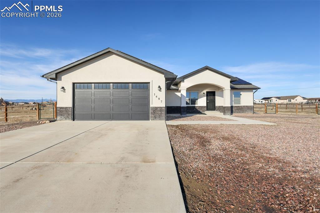 Welcome to acreage living in Pueblo West, where space, views, & modern comfort come together. Perfectly positioned on 1.14 acres at the end of a peaceful cul-de-sac, this 2020-built ranch-style home w/ a finished basement offers 3,236 sq ft, 5 bedrooms, 4 bathrooms, an attached 2-car garage, & RV parking, w/ plenty of room to expand your outdoor vision & take in stunning mountain views. Enjoy the best of main-level living w/ a primary suite on the main floor, plus a spacious junior suite in the basement. Step inside & you’ll immediately feel the bright, open layout designed for both everyday living & effortless entertaining. The spacious living room is anchored by vaulted ceilings, filled with natural light, & flows seamlessly into the kitchen & dining area. The kitchen is the true centerpiece, featuring granite countertops, a large island, generous cabinetry, a pantry, & stainless appliances, making it easy to cook, connect, & serve w/ ease. Just off the dining space, step outside to a covered concrete patio, perfect for unwinding & taking in the wide-open CO skies. The primary suite is conveniently located on the main level & offers a private, comfortable retreat w/ an attached bath featuring a double vanity, walk-in shower, & a spacious walk-in closet. Nearby, a main-level laundry space adds everyday ease, while 2 additional bedrooms & a full bath provide flexible space for guests, office needs, or hobbies. Downstairs, the finished basement delivers even more room to spread out with an expansive family room & excellent separation of space, making it ideal for multi-generational living. It features a junior suite w/ a huge bedroom, an attached full bath, & an oversized walk-in closet or bonus room. A 5th bedroom in the basement also includes its own attached 3/4 bath & closet, offering added privacy & flexibility. Additional upgrades include active solar (24 panels), a tankless on-demand water heater, & a radon mitigation system, supporting comfort & efficiency.