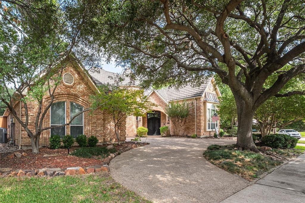 LOCATION LOCATION LOCATION!! Tucked away at the end of a quiet CUL-DE-SAC backing to a serene CREEK with Chisolm Trail Park and walking trails a mere 3 minute walk away is where you will find this stunning 5-bedroom ESTATE. A grand entrance welcomes you with soaring vaulted ceilings and a magnificent winding staircase, setting the tone for the impressive interiors. An elegant formal dining room showcases classic wainscoting, while the sophisticated formal living room features a beautiful fireplace and intricate crown molding. Designed for entertaining, the gourmet kitchen boasts granite, an island, dual raised breakfast bars, SS appliances, abundant cabinetry, and generous prep space. A charming breakfast nook overlooks the picturesque backyard and features a built-in planning desk and hutch. Inviting family room showcases hardwood floors, handsome wood-paneled walls, a brick fireplace framed by custom built-ins, and a wet bar. The thoughtfully designed floor plan offers PRIMARY SUITE  and a private MOTHER-IN-LAW SUITE down, and three additional bedrooms upstairs, providing wonderful flexibility for multigenerational living.The spacious primary suite offers elegant tray ceilings and a private ensuite bath. Upstairs, an expansive game room with its own sink and bar creates the perfect setting for entertaining. An oversized utility room with a sink, extensive cabinetry, and space for an additional refrigerator adds everyday convenience, while abundant attic storage and a central vacuum system enhance functionality. Step outside to your private backyard retreat featuring a beautifully remodeled pool and spa (2023), expansive covered and open patios, and a board-on-board privacy fence. Additional highlights include a circular driveway, oversized three-car garage, instant hot water at the kitchen sink, and a premium Class 4 impact-resistant, stone-coated steel roof. New family room doors are on order. This remarkable estate is truly a place to call home!