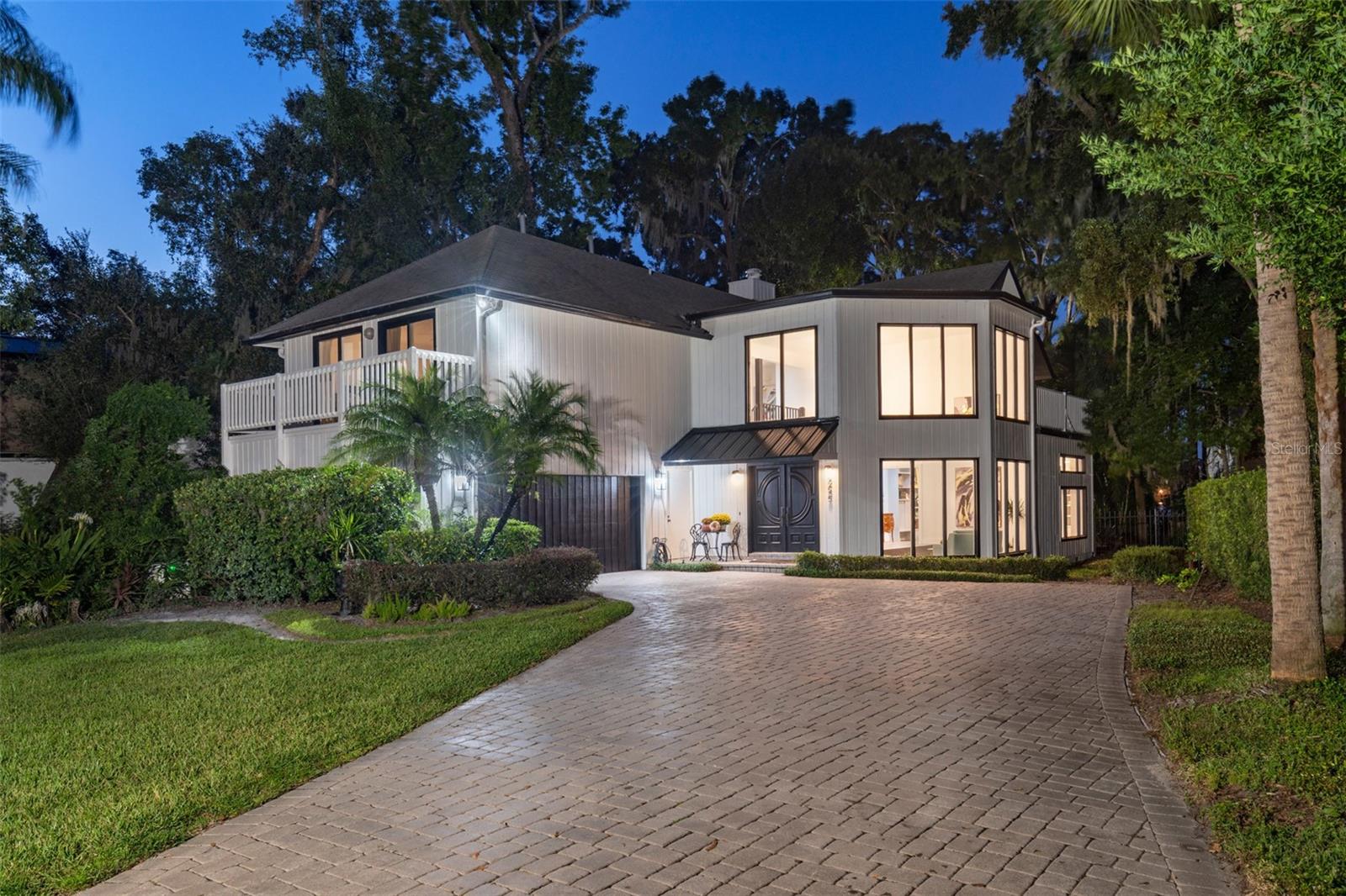 Under contract-accepting backup offers. An incredible Winter Park Chain-of-Lakes opportunity on Lake Virginia with clear views of Rollins College. This transitionally designed home, situated in the highly coveted Virginia Heights, offers an opportunity like no other with proximity to Park Avenue coupled with the lakefront amenities through a Venetian canal system that uniquely connects five lakes and captures the quintessential Winter Park lifestyle. This four-bedroom three-and-a-half-bath home invites you into a two-story foyer surrounded by windows and natural light. The spacious kitchen features a mid-century tile backsplash, light cabinetry and a window out to the pool and lake. The main living space features a beautiful fireplace and back atrium that invites the stars and twinkling sunsets from the water. The separate dining room is spacious and there is an additional den or office space to round out the first floor. All bedrooms are upstairs and generously sized providing flexibility and the primary bedroom has the most incredible lakefront views. A clear water canal runs alongside the home and spills into lake Virginia adding to the ambiance of the backyard where nature abounds. Continue the existing renovation with your own style or build a house of your dreams. Impeccably located with shopping and dining at your fingertips as well as Rollins College. Fantastic schools with Audubon K-8 and Winter Park High. Don’t miss this one – call for your private tour.