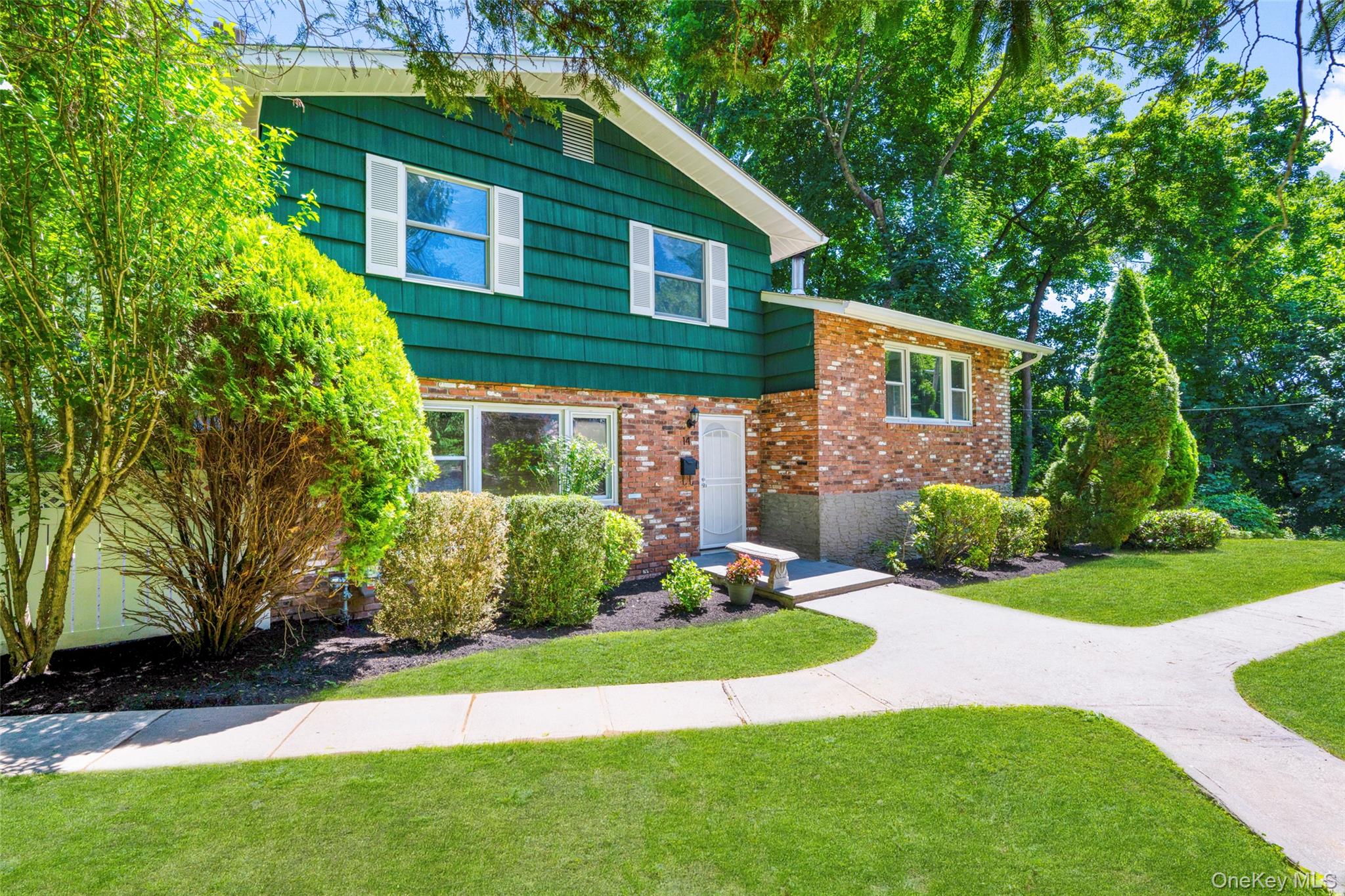 Welcome to this beautifully maintained split level home nestled in the Battle Hill neighborhood of White Plains. Step inside to discover gleaming hardwood floors throughout, freshly painted interior, and a bright comfortable layout designed for everyday living. Find an eat-in kitchen and living room with an inviting classic brick fireplace that creates a warm focal point, and powder room all on the first level. Discover additional living space with a sliding door, providing endless possibles to fit your lifestyle.Up a few steps, are 3 bedrooms and 2 full bathrooms. This inviting residence provides a generously-sized fully fenced landscaped yard with direct access to a spacious patio and playground for outdoor living! Recent upgrades include new gas pipes, utility upgrades, higher efficiency gas pressure and external meters. Just under 10 minutes walk to the train 0.4 miles. Near downtown White Plains, shopping, dining, parks, transportation and major parkways. Delivering an exceptional commuter friendly lifestyle in a sought after location!