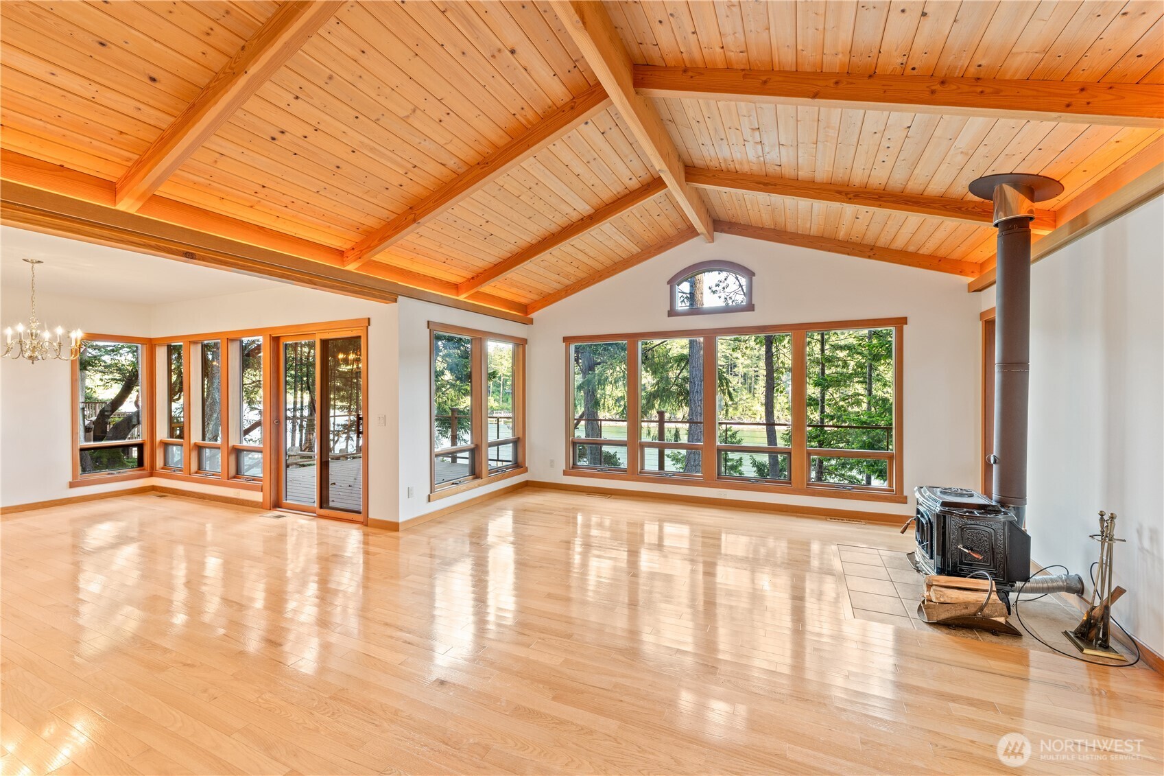 Roche Harbor waterfront gem, in coveted Davison Head area. Beautiful 3+ bedroom, 2.5 bath NW Contemporary style with warm exposed beams, vaulted wood ceilings and hardwood floors. Open layout, quality craftsmanship and timeless charm. Bathed in south-facing natural light with expansive windows that bring the outdoors in. Relax on spacious decks. Tranquil setting. Stairs to pristine shoreline in protected bay, perfect to launch your kayaks or stand up paddleboards. Generous closets and storage areas, and attached 2-car garage provide plenty of space for all your island adventures. Move in ready!