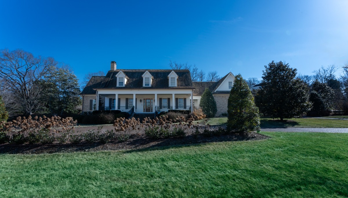 Cape Cod style house with deep front porch on one acre lot. Level, fully fenced backyard includes a gorgeous terrace, pergola, and pool   Landscape design by Ben Page. Mature plantings include large magnolias and boxwood hedges. Pool house has half bath and storage. 22x21 screened porch opens to terrace. Primary bedroom on first fl. Laundry rooms on both floors. Media room (2nd fl) and large office (1st fl). Bedroom 5 could also be an exercise or yoga room.