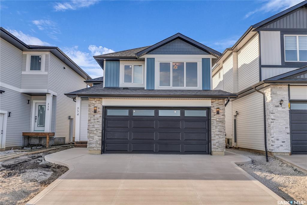 Great location with this Beautiful newly built house that is situated in the popular Kensington area of Saskatoon! Kensington has parks, walking paths, schools & close proximity to many amenities. This stunning newly built home is a 1251 sq. ft modified Bi-level with a double attached 23x20 garage and a finished 2-bedroom legal basement suite. The house boasts exceptional craftsmanship and attention to detail for anyone looking for a luxurious and comfortable living space. The main features upgraded 6.5mm vinyl plank flooring, it has a large foyer, open concept kitchen to dining/living area, a 4-piece bathroom, 2 good sized bedrooms and access to the garage as well as the utility room with plenty of storage. The 2nd floor of the home has a large primary bedroom that features a walk-in closet and a 3-piece ensuite bathroom. The basement has separate entry into a legal 2-bedroom basement suite. It features 2 bedrooms, a 4-piece bathroom, laundry, kitchen, living and dining area. There is the possibility to qualify for the Sask. Secondary Suite Incentive (SSI) Grant Program where the ministry of finance provides 35% of the total price to construct a new secondary suite at an owner’s primary residence, to a maximum grant of $35,000 per qualifying property. There will be a concrete driveway & front landscaping that has sod on both sides/1 tree included. Saskatchewan New Home Warranty is included. GST/PST is included in the purchase price with the rebate to the builder. Appliances are included. Do not wait! Call to view! (Photos are of a similar built house., house is almost completed.)