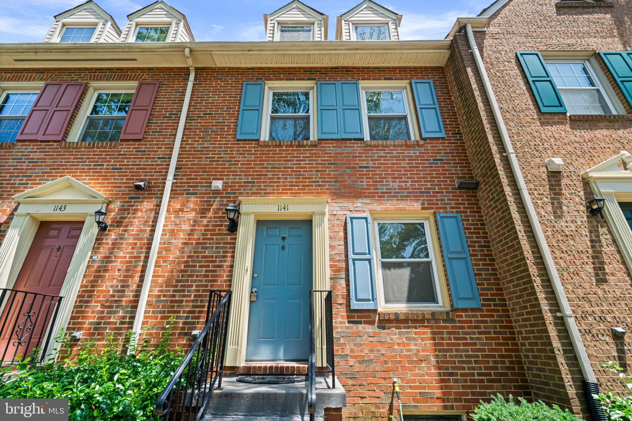 Welcome to 1141 N. Vernon Street, a beautifully maintained town home in the heart of Ballston. It offers 3 bedrooms, several versatile flex rooms, 3.5 bathrooms, and a convenient location near the metro, restaurants, shops, and parks and trails.  The main level features a beautifully renovated white kitchen (2020) that flows seamlessly into the dining area containing elegant crown molding and a chandelier. Just beyond, the living room, anchored by a cozy wood-burning fireplace, opens directly to a private fenced patio- perfect for relaxing outdoors or hosting guests. Upstairs, the spacious primary suite offers two closets and an en-suite bath, while the second bedroom is served by a full hall bathroom. The top-level loft, complete with two skylights, a ceiling fan, closet, and charming window alcoves with built-in auxiliary AC unit, provides the flexibility of a comfortable third bedroom, home office, or guest suite. The finished lower level expands the home's living space with two bonus rooms, a full bathroom, under-stair storage, and a dedicated utility room with Whirlpool washer and dryer—ideal for guests, a home gym, office, or hobby space. Additional highlights include an assigned parking space (#22), ample storage, and a private outdoor retreat. Ideally located just 0.4 miles from the Ballston-MU Metro Station (Orange and Silver Lines), approximately one mile from Virginia Square-GMU Metro, and only blocks from Ballston Quarter, Target, Harris Teeter, restaurants, shopping, parks, and entertainment. Commuters will appreciate the quick access to I-66 and N. Glebe Road. Located within the sought-after Ashlawn Elementary, Key Immersion or Swanson Middle, and Washington-Liberty High School pyramid, this home offers the perfect combination of comfort, convenience, and an exceptional Arlington lifestyle.