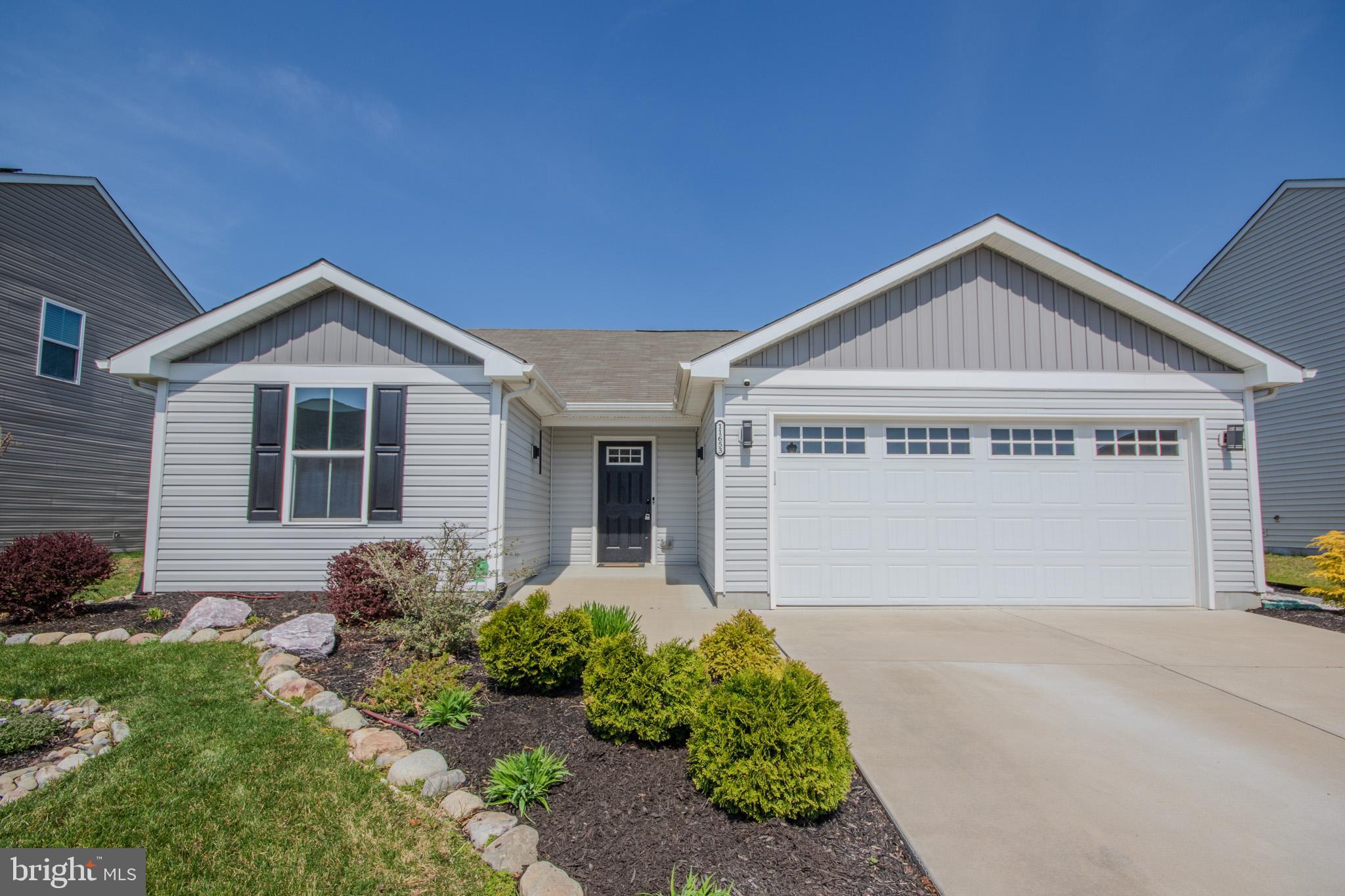 Welcome to 11653 Buckingham Drive in the desirable Yorkshire Estates community. Conveniently located just over the Maryland/Delaware line, it offers the perfect blend of comfort and accessibility. This well-maintained 3-bedroom, 2-bathroom home features 1,270 square feet of thoughtfully designed open-concept living space, ideal for everyday living and entertaining alike. The kitchen is equipped with modern conveniences, including a dishwasher, electric range, and microwave that are all 3 years old or newer — providing both style and peace of mind. The home includes accessibility-focused design features, with a smooth, adapted path of travel from the driveway through the front door and into the primary bedroom and bathroom. Interior doorways are 36 inches wide, and the primary bathroom has been thoughtfully adapted to enhance accessibility and ease of use. Enjoy relaxing mornings or cozy evenings in the bright 3-season sunroom, or step outside to the patio overlooking a fully fenced backyard that is perfect for gatherings, pets, or play. Garden enthusiasts will appreciate the four established wooden planters, ready for seasonal flowers, herbs, or vegetables. Additional highlights include an attached 2-car garage for secure parking and extra storage, as well as a welcoming neighborhood setting that combines suburban charm with easy access to nearby amenities. This move-in-ready home offers comfort, functionality, and outdoor enjoyment—all in a prime location. Schedule your private showing today!