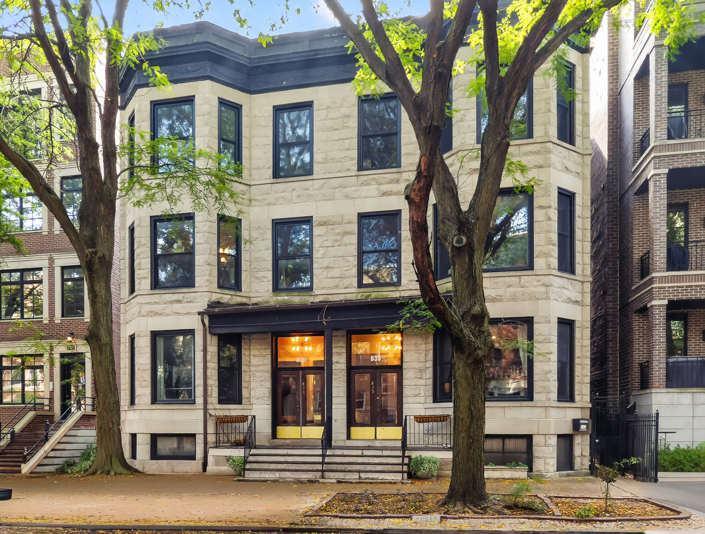 Discover the charm of this beautiful vintage building on Buckingham Place, ideally located just a stone's throw from Wrigley Field and within walking distance of your favorite restaurants. Enjoy easy access to the lakefront and scenic bike trails, making this Chicago property a true gem. This spacious unit features two full bedrooms and two bathrooms, along with a versatile bonus room that can serve as an office or extra dining area for entertaining guests. As you step through the front door, you'll be greeted by a large living space adorned with a decorative(gas) fireplace and expansive windows that fill the room with natural light. The woodwork throughout the home is breathtaking! The unit boasts a brand new in-unit washer and dryer(2020) for your convenience, along with a fully remodeled second bathroom with a custom walk-in shower. The kitchen has been beautifully remodeled, featuring a stylish backsplash, modern counters, and sleek hardware, complemented by stainless steel appliances and a convenient wine fridge. (2020) New light fixtures and ceiling fan throughout the home! Ecobee thermostat, Nest CO2/Smoke detectors added to home, and Furnace replaced in 2023. With a common area in the back to relax and unwind, this property truly offers a perfect blend of vintage charm and modern amenities. The basement common area offers extra laundry space and a huge assigned storage unit for the home. Don't miss out on this must-see home in an unbeatable location!