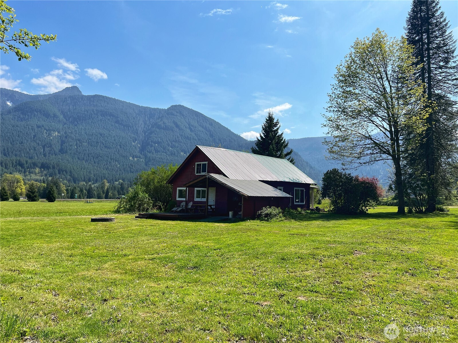 40+ acres, 3 parcels, stunning 2,300+ ft of Cowlitz River frontage, private beach, & your own little slice of history on a ~1900 homestead. 1,550+ ft of Garret Creek flow through the east edge. Spectacular territorial views surround you from everywhere on the property. The home is mostly original with rustic shiplap &  interior and remnants of antique wallpaper. There is newer electrical and a pellet stove, but owners consider the home a “glamping” cabin. Approximately 33 acres of harvestable hayfield & mature timber. Long-standing water rights from gravity-fed spring since 1910. Power and water are available at the camping/picnic area. Large fenced garden area with raised garden beds. Build near Mt Rainier and White Pass Ski Area!