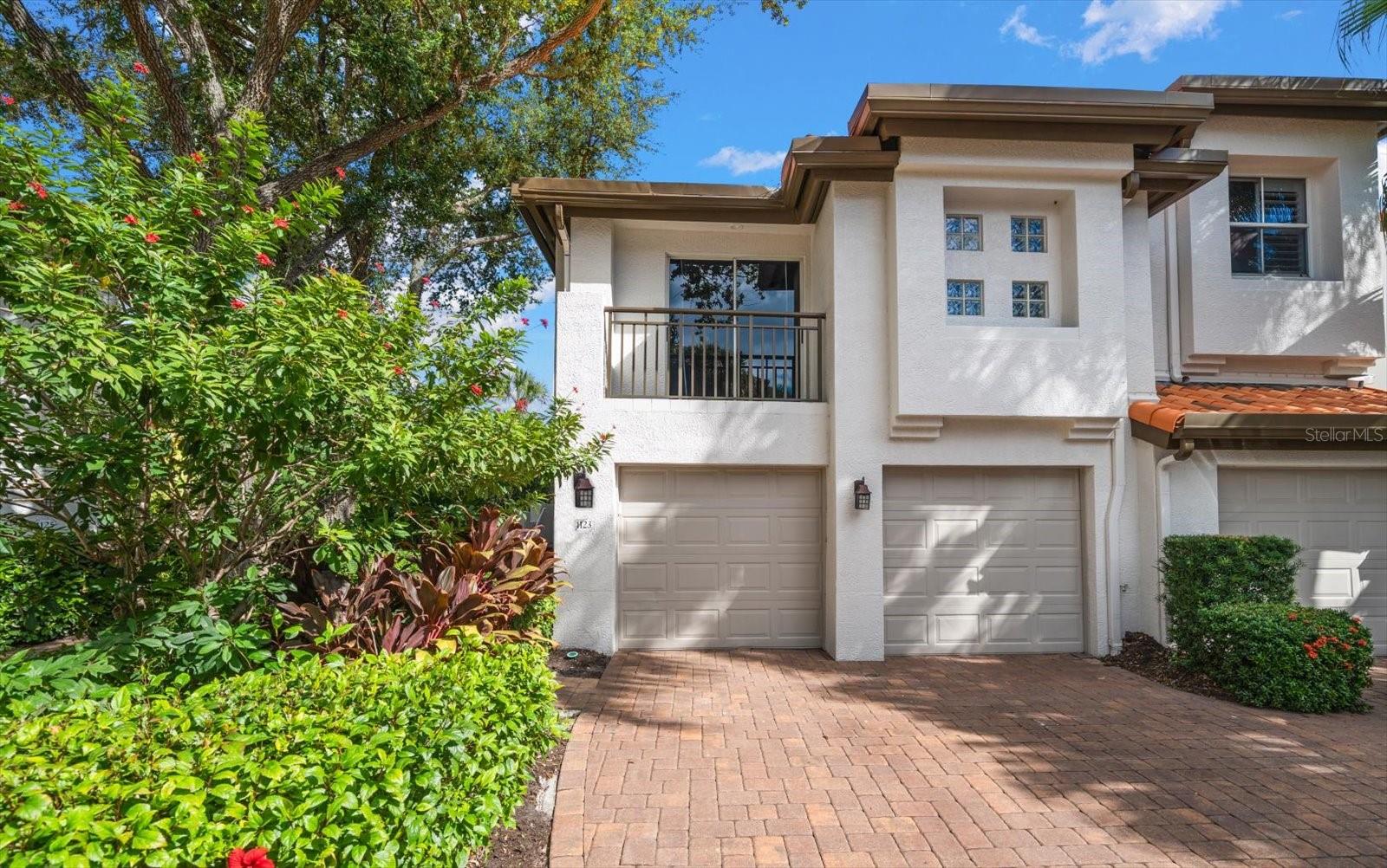 One or more photo(s) has been virtually staged. Your paradise awaits in the heart of Tampa located in the 24-hour gated community of Harbour Island. The perfect Lifestyle awaits you in this Mediterranean style corner/end home with two bedrooms plus a loft area used as an office, two bathrooms upstairs, 2-car oversized garage on waterfront (Sparkman Channel), surrounded by lush landscape with a private side entry that captures your imagination of what's inside. Current owner's created an incredible open floor plan that combines casual elegance with enhanced outdoor entertainment area on the oversized composite engineered deck. The floor plan has open views of water from every area of the downstairs with an updated kitchen that offers a wonderful island with marble counter that seats four, large stainless steel basin sink with designer faucets, the cabinetry has pull-out shelves that adds to your convenience and has a microwave hidden in the cabinets. A creative feature is the wine cabinet that stands between the kitchen and dining area. It will keep your wines cool and possibly use the bottom cabinet for a humidor or your favorite bottles. A nicely appointed half bathroom next to the updated stairwell that has featured crown molding and wainscotting. The downstair areas have crown molding, chair-rail, two tone designer paint color, battery operated shades, window treatments, alarm system with glass break, HVAC's (2024) with UV Lights on Handlers, home surge protector, LED lighting throughout and smart phone wired.  Additional features are the matching lighting in dining area and pendants over the kitchen island, recessed lighting to include under counter lights that enhance the overall experience of the kitchen. Imagine anytime of the day enjoying light bright, airy views of the water a spectacular lifestyle with all the location has within walking distance. On to the upstairs where a guest room is large and may be considered a second master with walk-in closet that has built-ins a barn door on order and a bathroom with dbl vanities, garden tub and a separate shower. As we move to the Primary you will pass a very nice niche area that was used as an office space, has cabinets for storage. The Primary bedroom is large with an area that may be used for additional seating or exercise equipment with wonderful views of the channel, the windows have plantation shutters that more than likely will remain open to enjoy the sunshine and tropical landscape. A spacious walk-in closet accessed through barn doors has built-ins to keep you organized. The ensuite has dual sinks, garden tub and a separate area for the walk-in shower and toilet. Additional enhancements are the wood floors with porcelain marble style floors in the bathrooms, water filtration system, you have fios and spectrum wired, electric vehicle station in garage, additional storage in garage area, impact rated doors that lead to the oversized deck surrounded by lush tropical landscape with the beautiful view of the water. You want Lifestyle and Location! this is the one for you within walking distances to upscale restaurants, Benchmark International Arena, Riverwalk, Sparkman Wharf and so many nice areas that will add to your quallity of life.