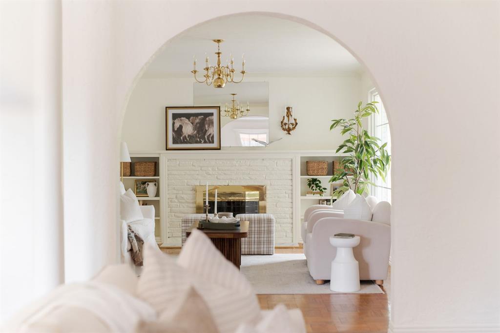 Effortlessly livable Nichols Hills ranch. The white-painted brick brings a clean, modern edge to its classic lines, and Inside, the open kitchen keeps everyone connected to the large living room, while a separate sitting room with a fireplace gives you a quieter space to slow down. With three bedrooms, two full baths, and an easy single-level layout, it’s the kind of home that feels comfortable the moment you step inside. Multiple doors open to a quaint backyard with a sunny deck and a small basketball goal— the perfect mix of relaxation and play. Just blocks from Christ the King and surrounded by the quiet streets of Nichols Hills Proper, this home is equal parts character and comfort.