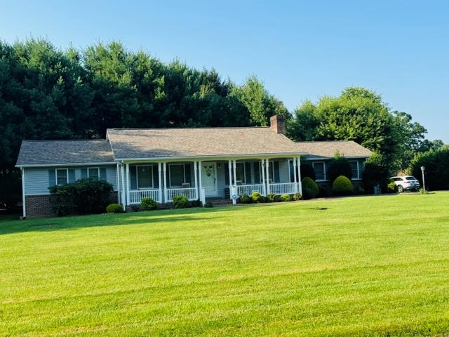Welcome home to easy, single-level living in the heart of Galax! Perfectly situated on a rare, level double lot, this beautifully maintained 3-bedroom, 2-bath home offers comfort, convenience, and room to grow—all within walking distance of downtown Galax, the public library, local coffee shops, restaurants, and everyday amenities.  Designed with accessibility in mind, this home is currently handicap accessible, making it an excellent choice for those seeking a more accommodating floor plan without sacrificing style or functionality. The spacious primary suite features an oversized bedroom and an exceptionally large walk-in closet, providing a peaceful retreat with plenty of storage.  The upgraded kitchen is the heart of the home, featuring newer appliances, abundant cabinetry, and a layout that flows effortlessly into the living spaces—perfect for everyday living and entertaining alike.  One of the home's standout features is the bright and inviting great room, where a wall of full-length windows fills the space with natural light and brings the beauty of the outdoors inside. Whether enjoying your morning coffee or hosting family and friends, this room offers a warm and welcoming atmosphere year-round.  Additional highlights include an attached two-car garage, ample parking, and a full unfinished basement offering endless possibilities. Create additional living space, a workshop, home gym, recreation room, or simply enjoy the abundant storage.  Finding a home that combines single-level living, accessibility, an oversized level lot, and a walkable location is a rare opportunity. Whether you're looking to simplify your lifestyle, retire in comfort, or enjoy the convenience of living close to everything Galax has to offer, this exceptional property is ready to welcome you home.