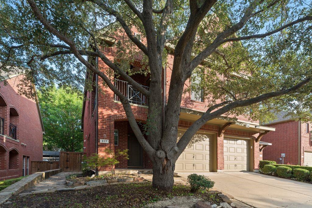 Welcome home to this beautifully maintained townhome offering the perfect blend of comfort, style, and functionality! Step inside to rich wood flooring, soaring ceilings, and an open-concept floor plan designed for both everyday living and entertaining. The spacious main living area features a cozy fireplace and flows seamlessly into the kitchen, complete with granite countertops, ample cabinetry, generous prep space, and a breakfast bar overlooking the living room. There's a powder room conveinent for your guests. Designed with flexibility in mind, this home offers two spacious living areas, providing plenty of room for entertaining, relaxing, or creating a media room, playroom, or home office. The first-floor primary suite serves as a private retreat with dual vanities, a soaking tub, separate shower, and a large walk-in closet.Upstairs, you'll find three additional bedrooms, two full bathrooms, a second living area, and a versatile bonus room. One of the upstairs bedrooms can easily function as a second primary suite, complete with its own private ensuite bathroom and direct access to a large balcony, creating the perfect private retreat for guests or multi-generational living.Step outside to enjoy the private patio surrounded by mature trees, offering a peaceful space to relax or entertain. With 4 bedrooms, 3 full bathrooms, 1 half bath, two living areas, a flexible bonus room, and two potential primary suites, this townhome provides the space and versatility today's buyers are looking for. Conveniently located near shopping, dining, entertainment, and major highways, this home is ready to welcome its next owner.