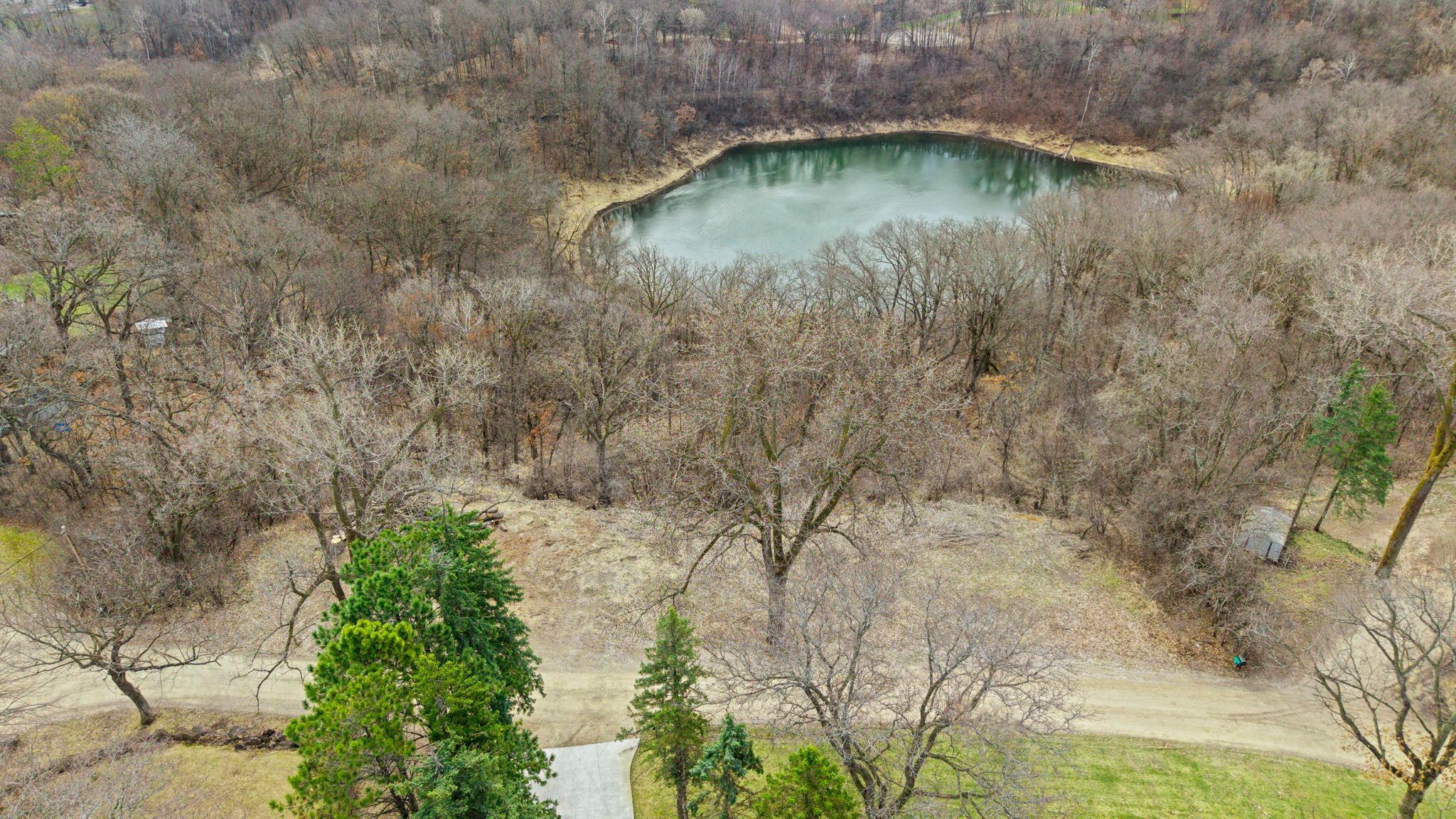 This spacious 1.66-acre lot is nestled in the highly sought-after Orchard Gardens neighborhood—a hidden gem within the city of Lakeville—offering stunning, wide-open pond views and a peaceful natural setting. Surrounded by mature trees, the property provides the perfect backdrop for your dream home. Enjoy the ideal balance of privacy and convenience with easy access to nearby amenities, including Lakeville schools, shopping, and community attractions. A rare opportunity to build in a serene yet connected location!