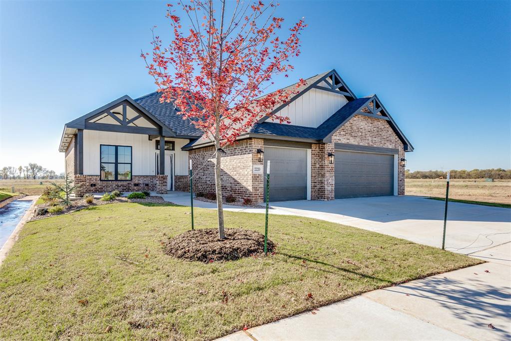 This stunning waterfront home in Sanabria seamlessly combines modern design with practical everyday living. The open-concept layout showcases a spacious living room with a dramatic vaulted ceiling and expansive windows that capture beautiful water views and fill the home with natural light. The covered back patio creates the perfect extension of living space for relaxing or entertaining while enjoying the peaceful waterfront setting.The gourmet kitchen is thoughtfully designed with state-of-the-art appliances, a huge center island, and stylish finishes that make it both functional and inviting. The luxurious primary suite offers a true retreat with a freestanding soaking tub, walk-in shower, and oversized walk-in closet.Additional highlights include a beautiful fireplace, dedicated office space, mud bench/drop zone, designer lighting, elegant tile work, granite countertops throughout, and numerous upgraded details.Residents of Sanabria enjoy exceptional community amenities including a 4,500 sq ft clubhouse, resort-style pool, and fitness center, adding even more lifestyle appeal to this incredible home.For a limited time only, builder incentives include a $3,000 Builder’s Special plus a $13,605 Early Bird Special.