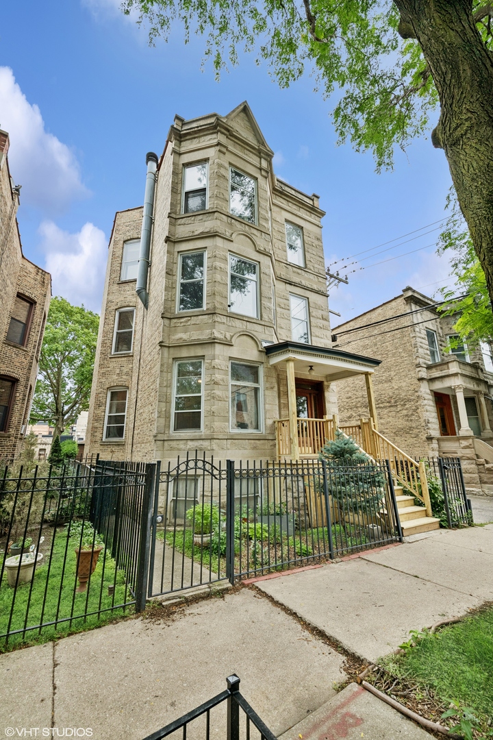 Welcome to this stunning 2 bedroom, 1 bathroom vintage greystone on a high first floor, blending timeless character with thoughtful updates. Step inside to find original woodwork, a built-in hutch, and hardwood floors that bring warmth and charm throughout.  The updated kitchen features 42" cabinets, stainless steel appliances, concrete countertops, a large island, and a pantry for extra storage. The primary bedroom offers a generous walk-in closet with custom organizers.  Enjoy the convenience of in-unit laundry and your very own private 2-car garage. Relax on the back porch overlooking an oversized backyard with a patio and beautifully maintained landscaping-perfect for entertaining or quiet evenings at home.  Nestled in the heart of Logan Square, this home combines vintage elegance with modern comfort, all within one of Chicago's most vibrant neighborhoods. Known for its tree-lined boulevards, historic architecture, and lively arts scene, Logan Square offers a unique blend of culture and charm. Residents enjoy an abundance of locally owned restaurants, cafes, and markets, along with easy access to parks, music venues, and community events.