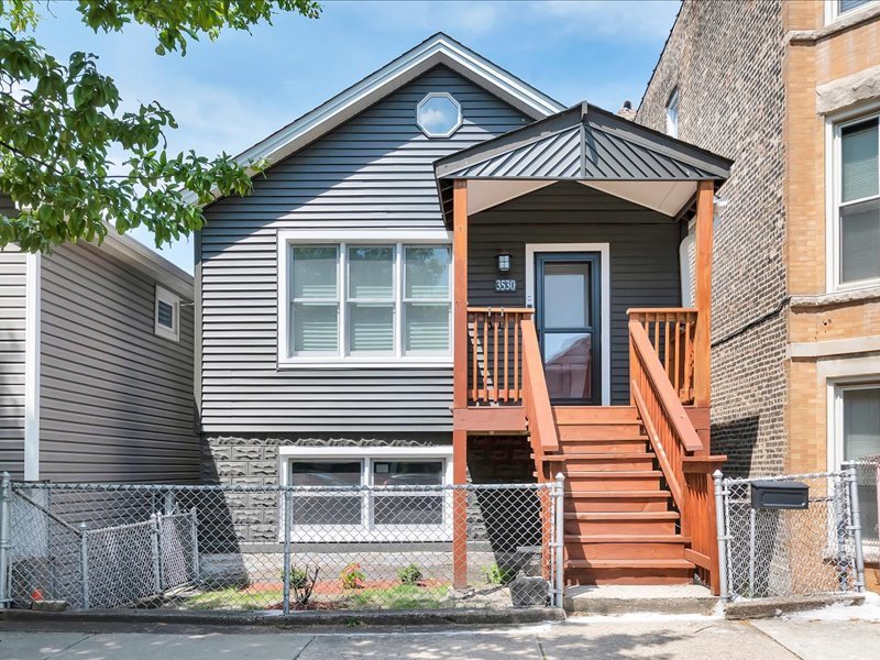 Welcome to timeless charm reimagined for modern living in this recently renovated home, nestled in Bridgeport's vibrant and highly sought-after neighborhood. Completely renovated from top to bottom, this open-concept residence blends historical charm with contemporary finishes and thoughtful design throughout. As you step inside, you're greeted by a bright, open concept main floor that seamlessly integrates the living, dining, and kitchen. Three bedrooms, two full baths, two living areas with private entrances. The Four-Season room at the rear opens directly onto a spacious "19X7" deck and a beautifully designed covered patio"20X13", creating the ultimate indoor-outdoor experience. The two kitchens with shaker cabinets, quartz countertops. Walking distance to Guaranteed Rate Field, Museums, Ramova Theatre, shopping, restaurants, coffee shops, public transportation, and all major expressways. 3530 S Union is ready for you to call your new home!