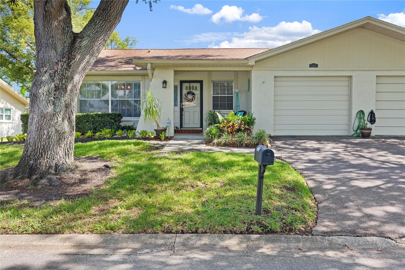 Beautifully Updated Villa in Desirable 55+ Dunedin Community of Heather Ridge! Welcome home to this spacious 1,400 sq ft 2-bedroom, 2-bath villa with an attached garage, ideally situated in one of Dunedin's most sought-after active adult communities. Thoughtfully updated, the seller has opened the kitchen to create a bright, open-concept floor plan that flows seamlessly into the living and dining areas, creating an inviting space for both everyday living and entertaining. Inside, you'll find a blend of luxury vinyl plank and engineered hardwood flooring throughout, offering both style and durability. The split-bedroom layout provides privacy and comfort for owners and guests alike. Major updates include a roof that is only four years old, a newly installed water heater, a hurricane-rated garage door, and an HVAC system approximately ten years old, providing added value, efficiency, and peace of mind for the new owner. Residents enjoy access to a sparklingcommunity pool and an exceptional low-maintenance lifestyle. The HOA fee covers cable TV, high-speed internet, exterior maintenance, pest control, water, sewer, and trash service, allowing you to spend more time enjoying the beauty of Dunedin. Conveniently located just minutes from Downtown Dunedin, shopping, dining, golf courses, parks, the Pinellas Trail, Honeymoon Island, and some of Florida's most beautiful Gulf Coast beaches, this villa offers the perfect combination of comfort, convenience, and carefree Florida living. Whether you're searching for a seasonal retreat or a year-round residence, this move-in-ready home delivers outstanding value in one of Tampa Bay's most desirable coastal communities. Call now for your private showing and start packing!
