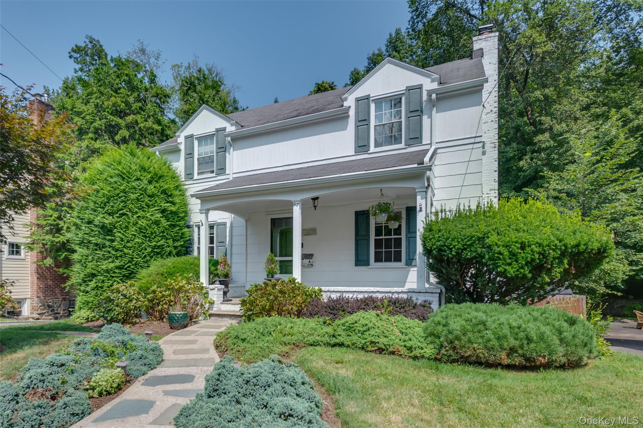 Nestled on a quiet street surrounded by New Rochelle's Nature Study Woods, this thoughtfully updated colonial offers the perfect mix of living in a vibrant, suburban neighborhood while offering a respite from the everyday hustle and bustle.  Recently updated with modern, chic finishes, the first floor features a living room with a wood burning fireplace, a crisp white powder room, and an open kitchen and dining room with new appliances, gleaming marble floors and stylish light fixtures. On the second floor, you'll find three generously sized bedrooms and a full bath with a tub/shower. There are wood floors throughout the home and the interior is freshly painted.  The walkout lower level is above ground and offers an additional 387 sq ft not included in the total sq footage. This bonus space can be used as a family room, gym, playroom, home office -- your choice! An attached garage provides additional storage. Located on a cul de sac, playing in the street, walking dogs, and conversing with neighbors is the norm. Equidistant commute to both Pelham and New Rochelle train stations and downtowns, you'll have the city at your fingertips.  Move right in and enjoy watching the leaves change colors from your bedroom window!