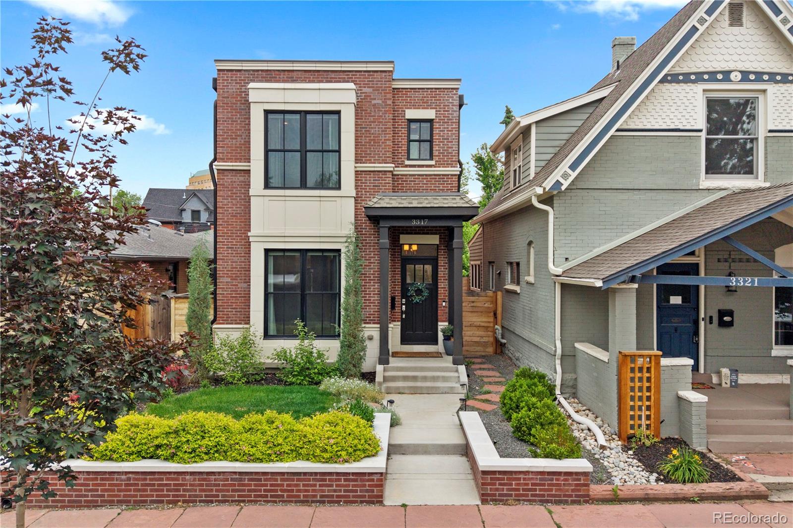 This high-end masterpiece home offers the pinnacle of luxury urban living with effortless access to the Highlands, LoHi, and Sunnyside.  From the moment you arrive, the professionally landscaped exterior sets a tone of sophisticated elegance. Inside, the home unfolds with luxury finishes and abundant natural light. The front living room boasts large windows that flow into a stunning, gourmet kitchen. A chef's dream, it features premium quartz countertops, luxury stainless steel appliances, and a large island with breakfast bar. The dining room hosts massive French doors that open to the backyard oasis. Off the dining area, a functional mudroom with laundry access guides you to the detached two-car garage, while a chic half bath completes the main floor. The upper level holds an architectural masterpiece of a primary suite. This private sanctuary features a show-stopping en-suite bathroom with two entirely separate entries—each boasting its own private sink vanity, custom water closet, and boutique walk-in closet. Connecting the two sides is a spectacular, dual-access walk-in shower. A second spacious bedroom with its own private en-suite bathroom finishes this floor. The fully finished lower level expands your entertainment options, hosting a large family room designed for cozy movie nights. Two additional bright bedrooms and a sleek 3/4 bathroom make this lower level ideal for guests or a quiet home office. Outside, the fully fenced backyard is designed for maximum enjoyment and low-maintenance care. Relax beneath a beautiful pergola-covered patio, surrounded by pristine, manicured landscaping that provides a private escape in the city. Enjoy premier walkability, sitting just two blocks from the vibrant boutiques and dining on 32nd Avenue. Acclaimed local favorites like Bar Dough, Highland Tap & Burger, and Duo Restaurant are just steps away, alongside elite fitness studios and upscale coffee shops.