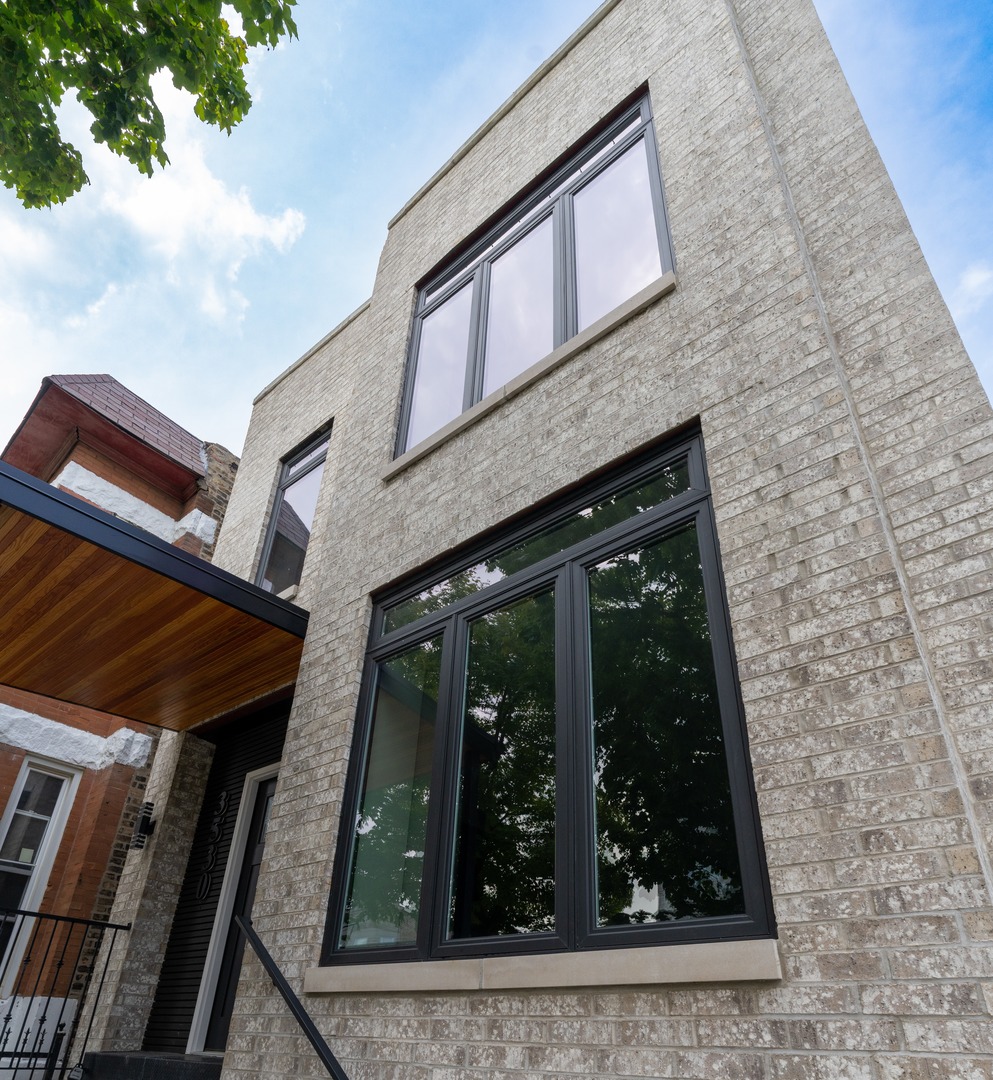 Welcome to 3530 W. Van Buren, a stunning new residence offering over 1900 square feet of sleek finishes, open concept design, and luxury at every turn. This beautifully crafted home features 3 spacious bedrooms and 4.5 designer bathrooms, an open-concept layout, and oversized windows that flood the interior with natural light. The master suite retreat includes a spa-inspired bath, an oversized walk-in closet with custom organization, and a private balcony. Additional bedrooms are spacious and inviting, each with access to beautifully designed bathrooms. The chef's kitchen is the centerpiece of the main floor with a striking waterfall island, premium stainless steel appliances, custom cabinetry, and a sophisticated butler's pantry. The living area is highlighted by a contemporary fireplace with a designer feature wall, creating the perfect space for entertaining. The master suite retreat offers a private balcony, spa-inspired bath, and a custom walk-in closet. The second floor includes a convenient laundry room. The expansive lower level boasts exquisitely beautiful floors and flexible space ideal for a media room, gym, guest suite, or home office. Wide-plank hardwood flooring runs throughout, and outdoor living is enhanced with a private rear deck and porch. Located with easy access to the 290 Expressway and CTA Blue Line, this home seamlessly combines elegance, functionality, and convenience. This home is perfect for entertaining, relaxing, and creating lasting memories. A must-see for buyers seeking refined modern living in Chicago!