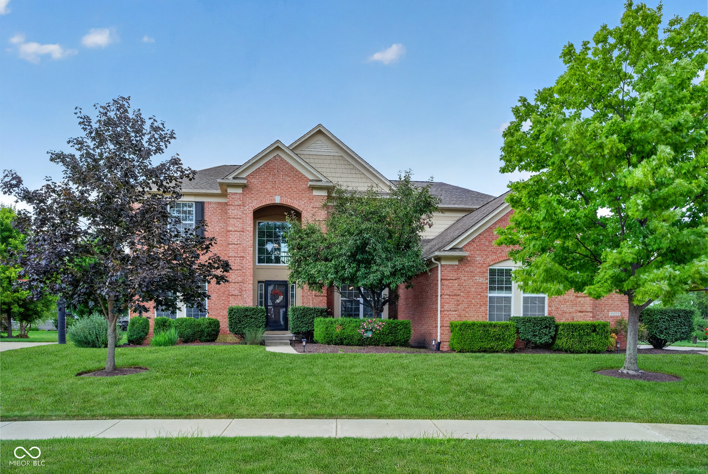 Awesome 5 BR/6 Bath (4 full/2 half) stunner with over 5,000 sf of living space in popular Gray Eagle!  Light, bright, and open floor plan with soaring two story entry! Living Room and Office off large foyer!  Dining Room with crown/picture frame molding!  Gorgeous solid Birch hardwoods installed 2024/25! Large Family Room with woodburning fireplace and gas starter! Updated kitchen includes granite countertops, s/s appliances, center island, double oven, gas cooktop, desk, walk-in pantry, and water purifier!  Double staircase leads to 4 upstairs bedrooms, 3 full baths, and laundry room with washer and dryer that stay!  Primary BR Suite has vaulted ceiling, sitting/exercise area, double sinks, separate garden tub and shower, and walk-in closest!  Huge basement includes 5th BR with large walk-in closet, full bath, custom bar with granite countertops and sink, and wine fridge!  New sump pump, battery back-up, and grinder pump recently installed!  Out back off the kitchen you'll find the 20x20 stamped concrete patio, pergola, and fire pit!  3 car sideload garage with basketball hoop!  Oversized .4 acre lot with irrigation system!