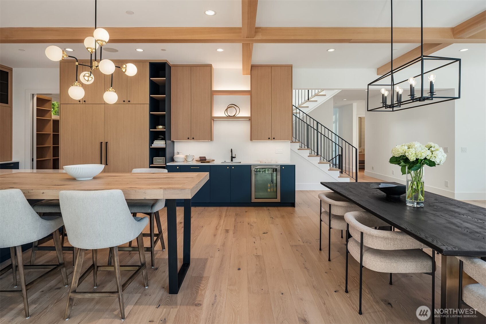 Wet bar with mini fridge, open to the staircase
