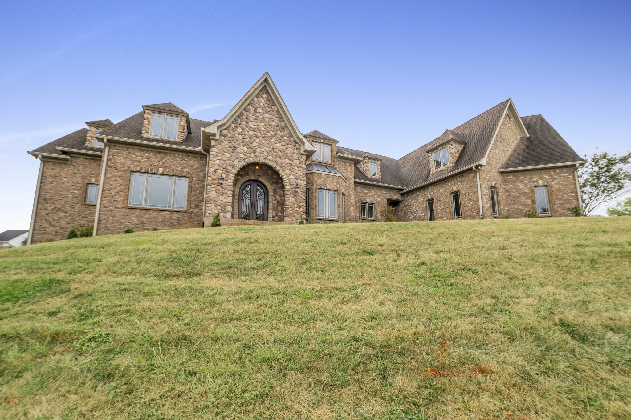 EXCEPTIONAL custom home, Hardwood Floors, Granite/Marble, 5 fireplaces, Gourmet Kitchen 2 DW, Stunning Master Suite w/his and her walk in closets, all bdrms are suites w/ Private Baths & Walk-in Closets. Bsmnt Rec Room, Work Out/bonus Room, home is wired for 3 home theaters, full wet bar in basement with DW. Unfinished space for more bedrooms upstairs. New paint and carpet throughout. Includes the lot next door, plenty of room for a large pool and pool house. The lot can be sold separately.