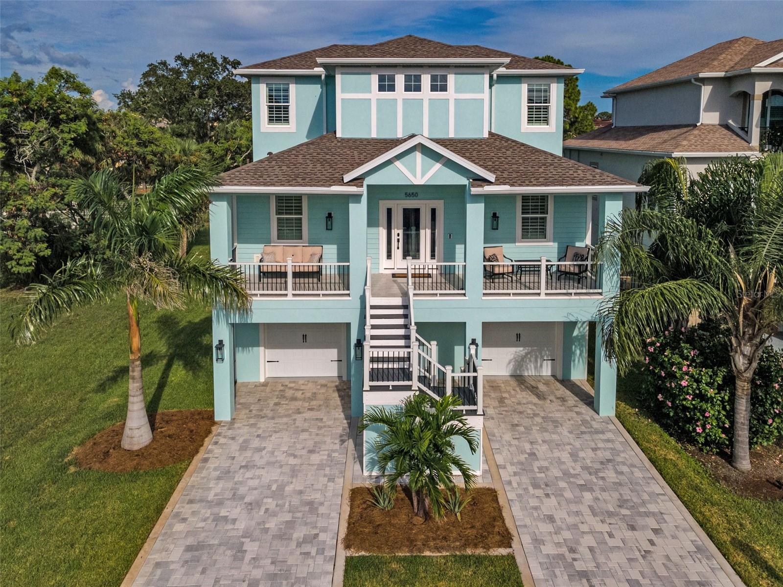 Welcome Home! Live the Florida Lifestyle in the small gated community of Egrets Place. SELLER IS OFFERING $20,000.00 TOWARD A MORTGAGE BUY DOWN!  Newly built home in 2024 with all the modern upgrades and design. Solid construction with the ground floor 4+ tandem garage and hurricane impact rated doors and windows throughout. Additional storage on the ground level for all your toys.  On the main floor, enter into the gourmet kitchen perfect for any chef. Kitchen upgrades include the quartz counters, stainless appliances, built in convection oven and microwave, induction cooktop with hood, 42” Shaker soft close cabinets and oversized breakfast bar. All flooring on the main level is Luxury Vinyl. Spacious great room for entertaining with plantation shutters and access to the outdoor patio. The primary suite is a retreat with patio access, custom walk in closet and custom barn doors leading to the ensuite bath. Relax and recharge in the soaking tub.  The third level is carpeted with 3 additional bedrooms, full bath and a loft that could be an office, media, playroom or exercise.  Enjoy the expansive backyard, perfect for sports or pets and room for a pool. Plans for a pool area are available! Additional upgrades include new tank-less hot water tank, gas line and an electric vehicle charger.   Fantastic Community amenities include a clubhouse, community pool, fitness center, tennis courts and a private boat ramp. Egrets Place is central to all the Tampa Bay Area has to offer. There is close by dining, shopping and medical facilities.   A short drive will take you to all area beaches, activities, sporting events and the Tampa International Airport.  In addition, join the Gulf Harbors Beach Club for a yearly fee of $200 and enjoy the private beach for members only.  Be sure and watch the video for more photos!