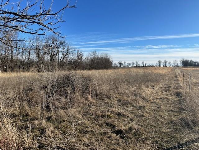 Small acreages are getting harder to find, and this 9.61-acre tract in Vernon County, Missouri is a standout opportunity. Located in the Bronaugh School District, the property features mostly open ground with a touch of timber—ideal for a home, barndominium, or hobby farm. With 139 feet of county road frontage, water and electric availability, and low taxes, this land offers both flexibility and long-term value.Build now or hold for the future—properties like this don’t last.