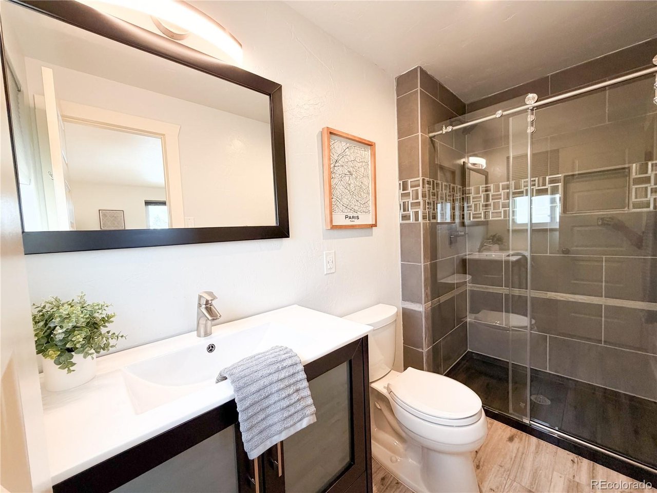 Welcome to this charming tri-level home located in the heart of Westminster. This 3-bedroom, 2-bathroom residence offers an open and inviting layout with thoughtful updates throughout. The open-concept main level features newly refinished solid oak hardwood floors and a spacious living area that flows into the kitchen. The renovated kitchen includes a peninsula with seating, generous counter space, and ample cabinetry for storage and meal prep. Upstairs, the primary suite offers plenty of space and a private 3/4 ensuite bathroom. Two additional bedrooms, a full bathroom, and newly refinished hardwood oak floors throughout complete the upper level, providing flexible space for a variety of needs. Recent updates include fresh interior and exterior paint, updated kitchen and bathroom finishes, updated tile work, thoughtful landscaping and exterior upgrades. The home is equipped with a Tesla solar system to help support energy efficiency and save money on monthly utilities. Outdoor features include a large, covered patio/deck and an expansive backyard with a storage shed-ideal for outdoor activities and gatherings. The oversized driveway provides off-street parking for up to four vehicles. No HOA. Conveniently located near shopping, dining, and outdoor recreation, this home offers easy access to a variety of local amenities.