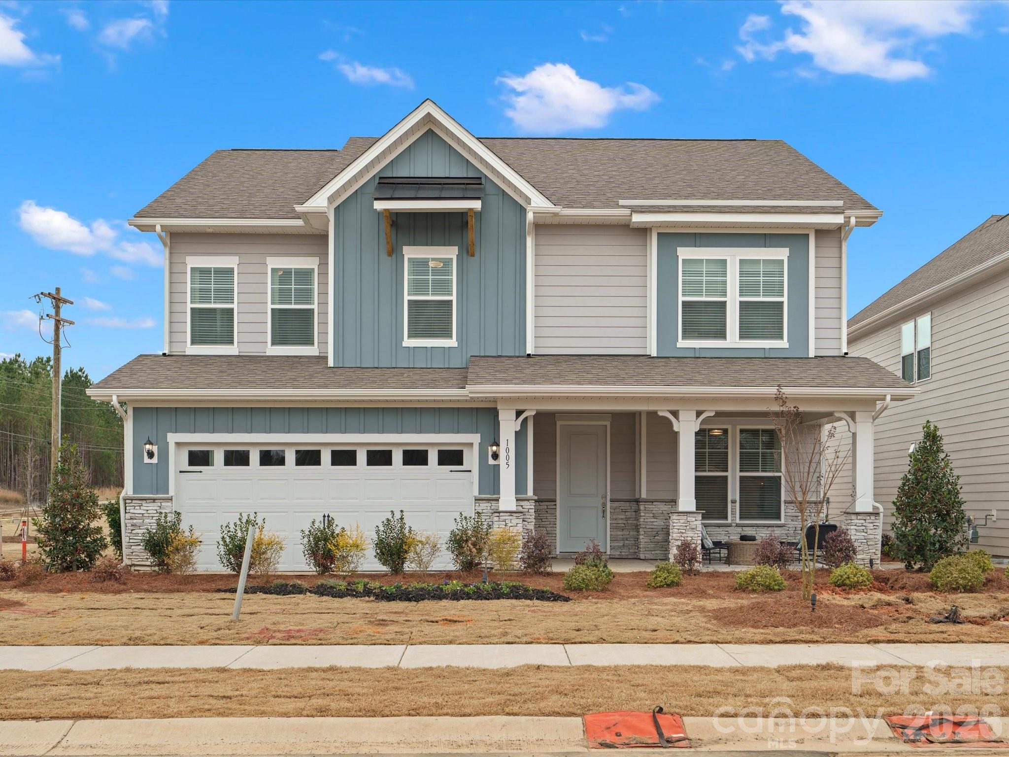 Built by the 2025 National Builder of the Year, welcome home to the Millbrook plan featuring 5 bedrooms and 4.5 baths. This home offers a guest suite on the main level, a convenient powder room, and a spacious family room that opens to the dining area and kitchen, perfect for everyday living and entertaining. The kitchen includes quartz countertops, a large island, an oversized walk-in pantry, and a gas cooktop.The primary suite offers a walk-in closet and a double-vanity bath with quartz countertops, with the laundry room located just outside for added convenience. Upstairs includes a large loft, three generously sized secondary bedrooms including one with its own private full bath. Outside you will find a large covered patio! We are conveniently located near US-74 and I-485, Moore Farms provides easy access to Uptown Charlotte, Matthews, Mint Hill, Concord, and Ballantyne. Enjoy the perfect blend of nature, convenience, and community in a location that keeps you connected to work, shopping, dining, and more.