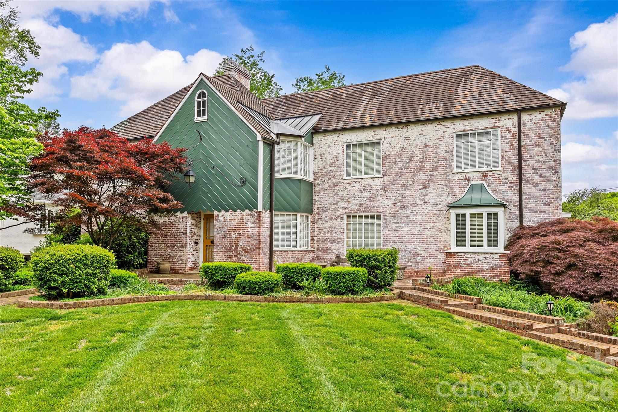 Exceptional opportunity on iconic Queens Road West in the heart of highly sought-after Myers Park. Set on a beautiful, .46-acre lot, this property offers a rare chance to renovate or build new in one of Charlotte’s most desirable locations. The existing full brick home offers approximately 3,585 square feet on the main and upper levels, and features a large walk-out basement that is partially finished and fully-framed, adding an additional 1,300+ sq/ft of area already under HVAC with updating and renovation potential. Combined with the attached 3+1/2 car garage, the current home provides a strong foundation for a complete transformation. The lot is truly special—lush, mature landscaping creates a private, garden-like setting rarely found at this scale. Enjoy living just moments from Freedom Park, nearby greenways, and the shops and dining along Selwyn Avenue, with a short commute to both SouthPark and Uptown. Whether reimagining the current home or building a custom residence, this is a premier opportunity in a coveted location. **Please note home is being sold in AS-IS condition**