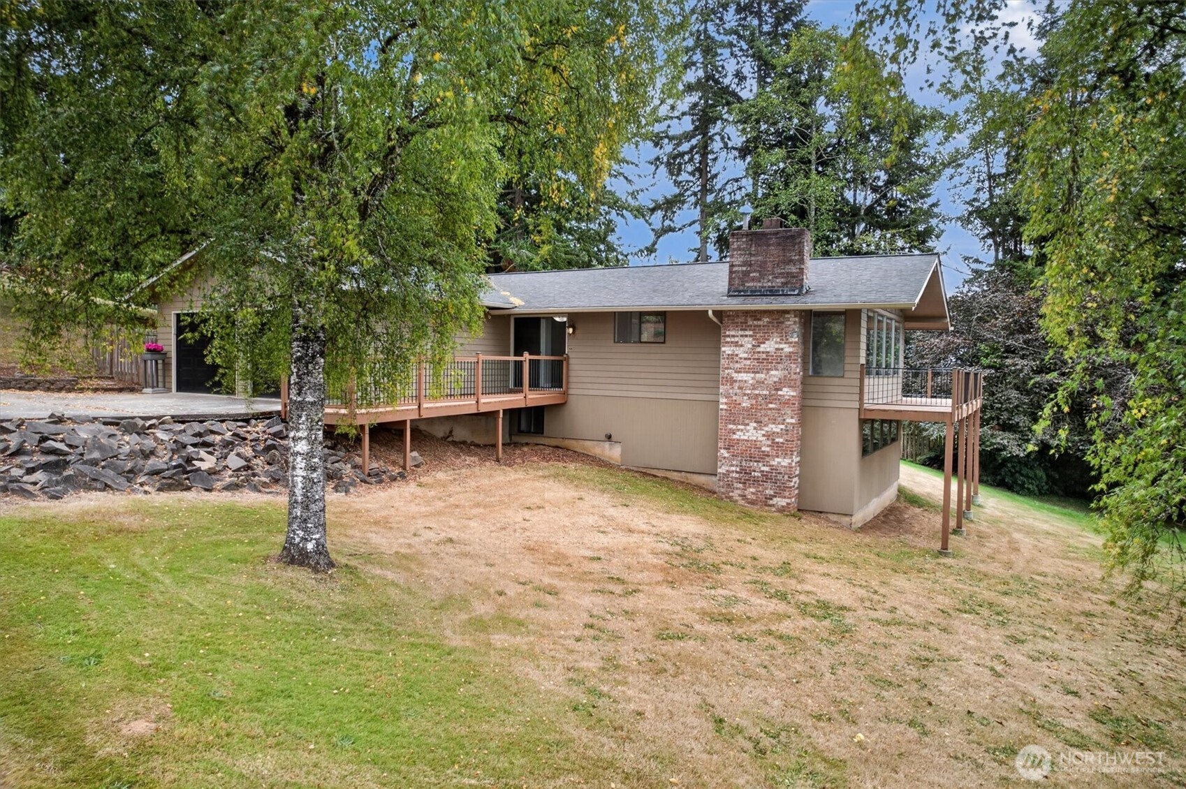 Tucked away on a quiet dead-end street near the golf course, this nicely updated home offers plenty of room to spread out on a double lot totaling 0.7 acres. Inside, the great room features vaulted ceilings with beautiful wood detail, while the remodeled kitchen and bathrooms give the home a fresh, updated feel. Enjoy convenient main-level living with the primary bedroom, laundry and entry all on the main floor, plus an additional room that would make a great office, studio or hobby space. Downstairs, the fully finished daylight basement adds two more bedrooms, a full bathroom and a second living area—perfect for guests, movie nights or just a little extra elbow room. Step outside to the spacious back deck and enjoy the peaceful setting and stunning sunsets. You're just minutes from downtown Cathlamet and access to the mighty Columbia River, yet nicely tucked into a quiet neighborhood. Centrally located, too—just over an hour to PDX or the beaches of Long Beach!