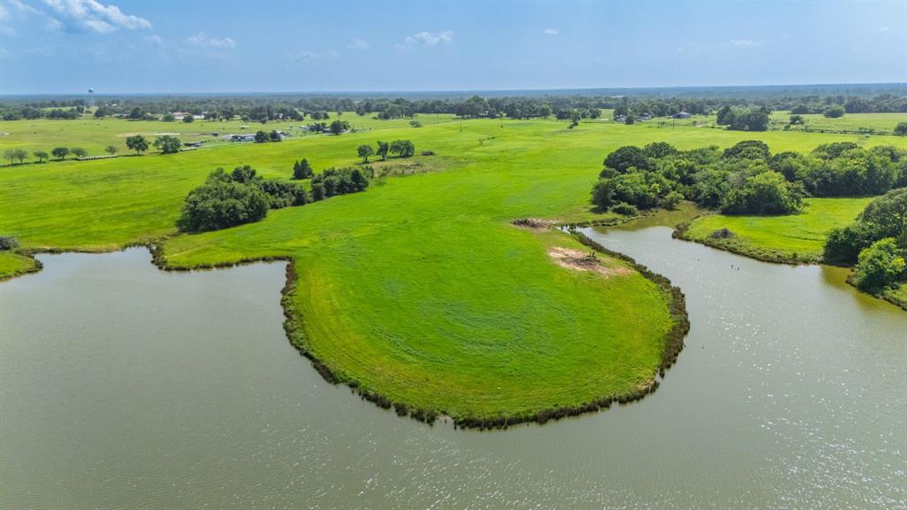 Here is possibly the most beautiful building spot in Hopkins County or all of NE Texas in this rolling 50 acre tract with hilltop overlooking a 17 acre private lake. This picturesque property also has a large (over 200') peninsula that also would create a unique home building spot near the water or a place for boathouse or pier. There is just enough trees along the lake to provide privacy and a little shade with several beautiful Oaks are scattered along the lake. This property has tremoundous sandy soil and the improved meadows that have been managed and provide ag-exemption on taxes for hay production and livestock. The lake provides unlimited opportunities for recreation, fishing, hunting and much more. When you see this property you will understand why this is one of the most sought after areas of Hopkins County and the location being only 5-6 miles from Sulphur Springs and Celebration Plaza for dining, shopping and all the great festivities and only a few miles from famous Lake Fork! Also, quick commute to I30 will get you to DFW in about 90 minutes. This is the perfect place for a lakeside home, investment, or that weekend getaway you have been looking for. With plenty of room and place to kick back and enjoy! Seller is open to working with buyers on boundaries as new survey will be needed at closing. 
35 additional acres avaiable and is included in an 85 acre tract mls listing #20974602.