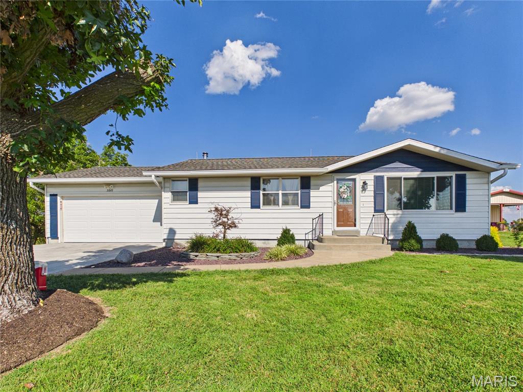 SECOND CHANCES DON'T COME AROUND OFTEN AND THIS ONE IS BACK! Back on the market through no fault of the sellers, this is your second chance to make this inviting 3-bedroom, 2-bathroom home yours! Privacy, convenience, and plenty of space come together in a peaceful setting that offers an out-of-town feel while still being just minutes from town. Multiple updates add to the appeal, including an HVAC system less than 10 years old, newer water lines throughout the home, and a new dishwasher. The main level features beautiful hardwood flooring, carpeted bedrooms, and ceramic tile in the main-level bathroom. The kitchen offers a moveable island with electric, plus a separate dining area, creating a functional space for everyday living and entertaining. The mostly finished basement provides valuable additional living space and includes a finished full bathroom, a dedicated laundry room, and a generous storage area designed to help keep everything organized. A wood stove provides a secondary heat source with vents throughout the home, adding warmth and comfort during the colder months. Convenient stairs from the basement lead directly to the garage, making everyday access and moving items in and out especially easy. The oversized attached one-car garage offers plenty of room for parking, storage, hobbies, and more. The garage has been newly insulated and features a new concrete floor, a new concrete apron out front, and a plethora of storage space. Step outside and enjoy one of the home's standout features the covered back deck! It is the perfect spot to settle in with your morning coffee, fire up the grill, relax on a crisp fall evening, or listen to the local football games on the radio while enjoying the peaceful surroundings. The landscaping is already taken care of, recently updated with maintenance-free rock and solar lighting, giving the exterior a polished look with minimal upkeep. If you're looking for a home that offers privacy and a relaxed setting while remaining only about 5 minutes from town, don't let your second chance pass you by! Come see how comfortably this home blends everyday convenience with the feeling of getting away from it all.